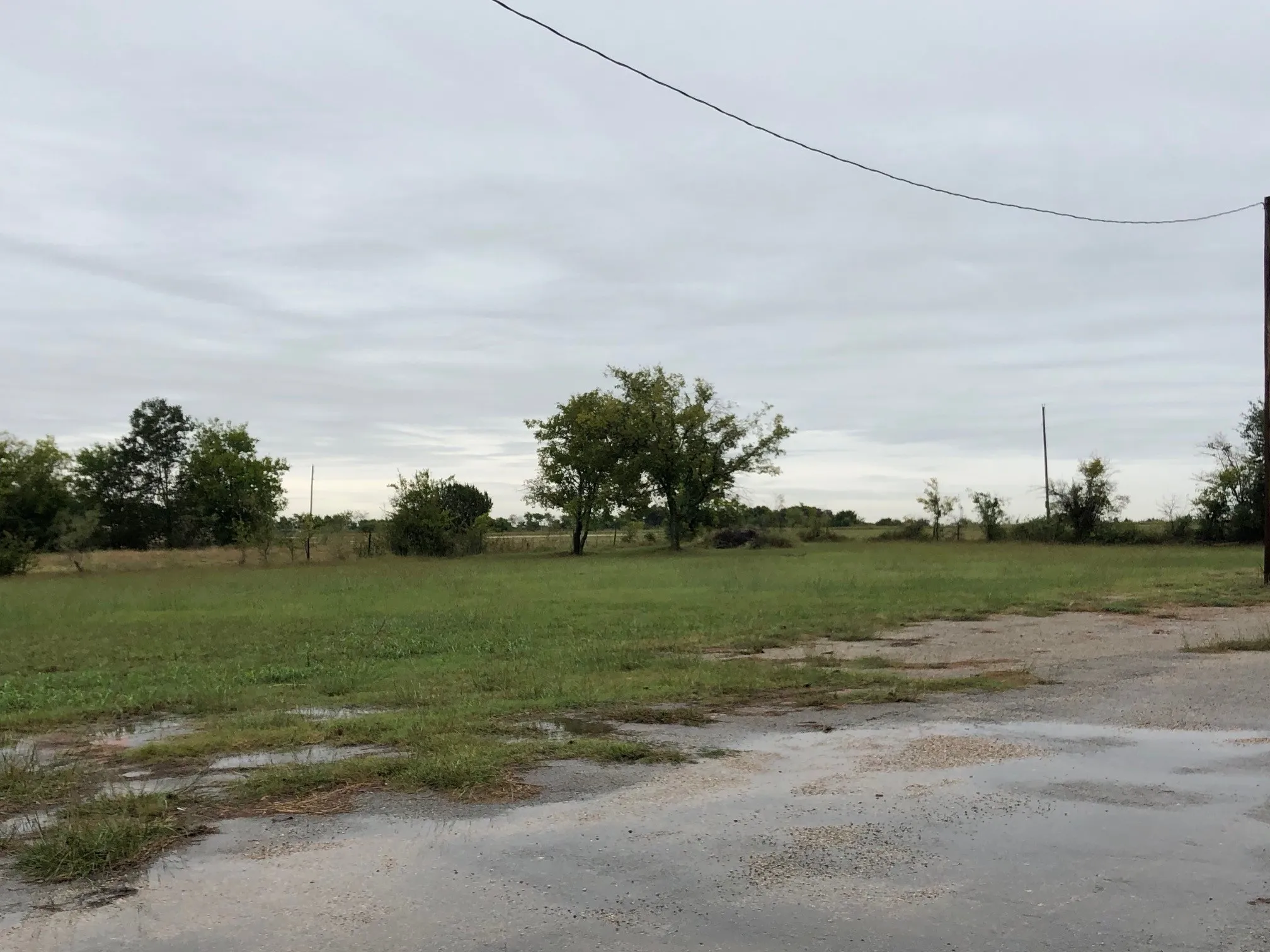 back acre of land-approx 1 acre vacant land and current rear parking lot