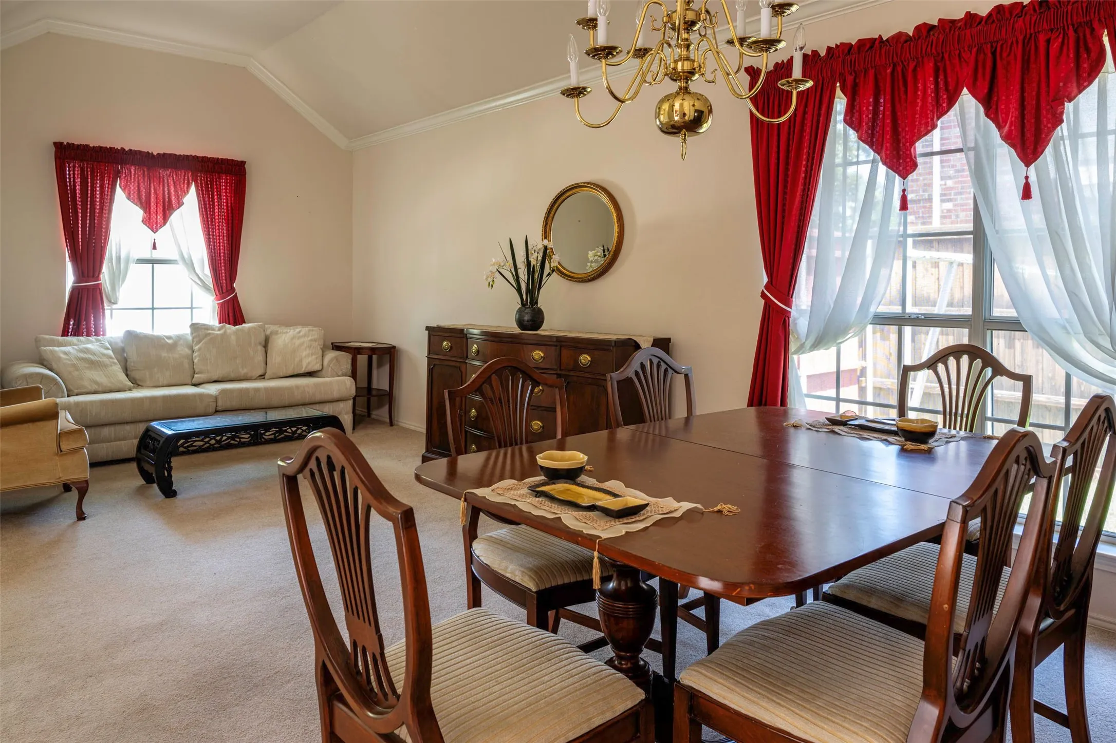 Dining area featuring crown molding, a large window.