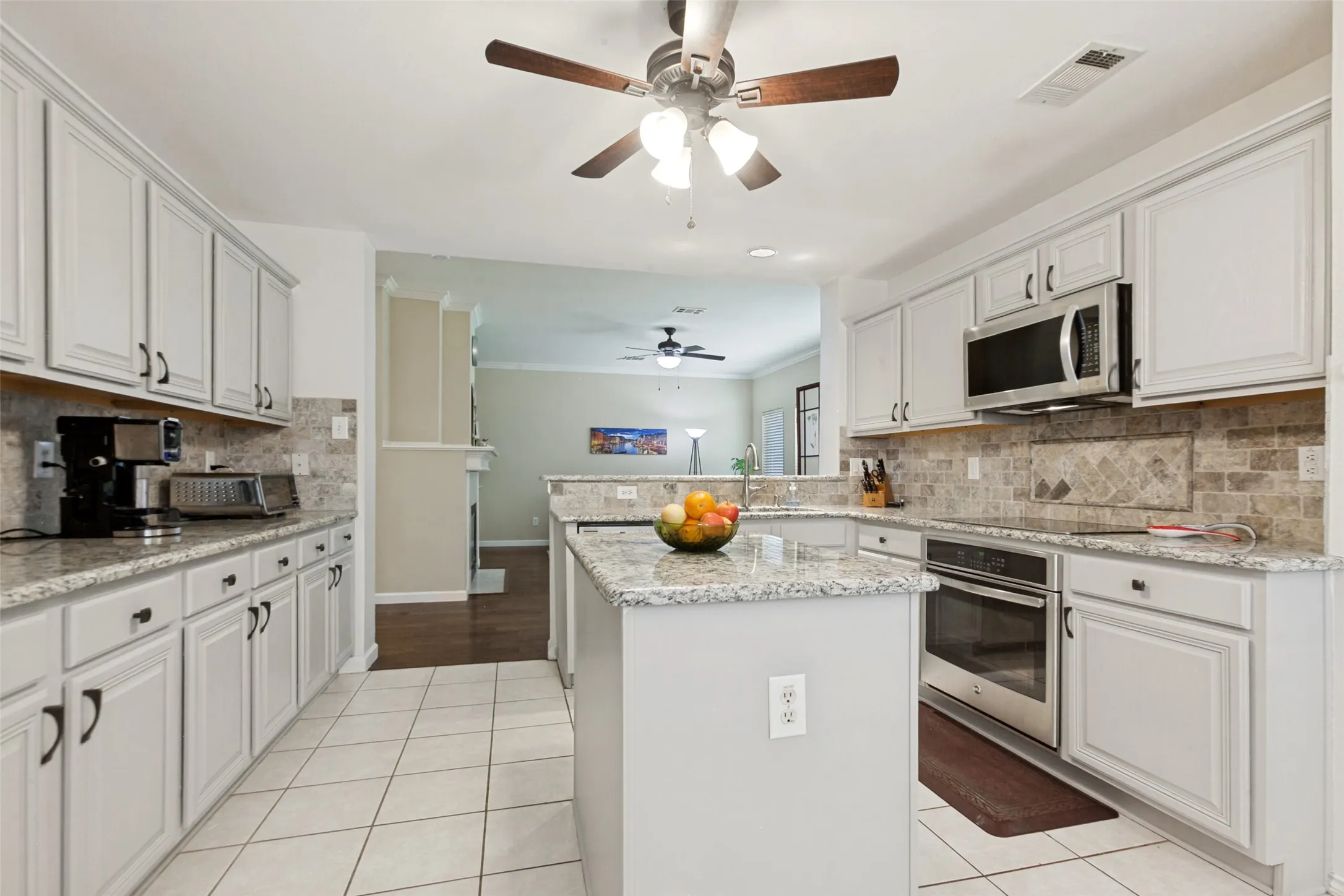 Kitchen opens up to the family room.