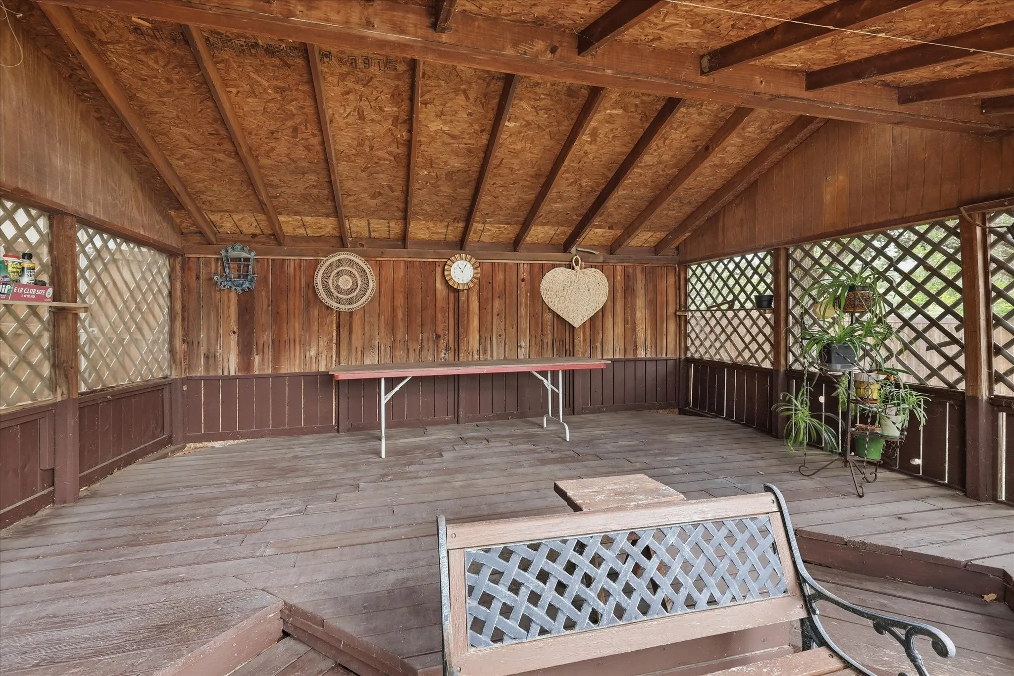 Gazebo on side of yard ready for a hot tub or an outdoor eating area