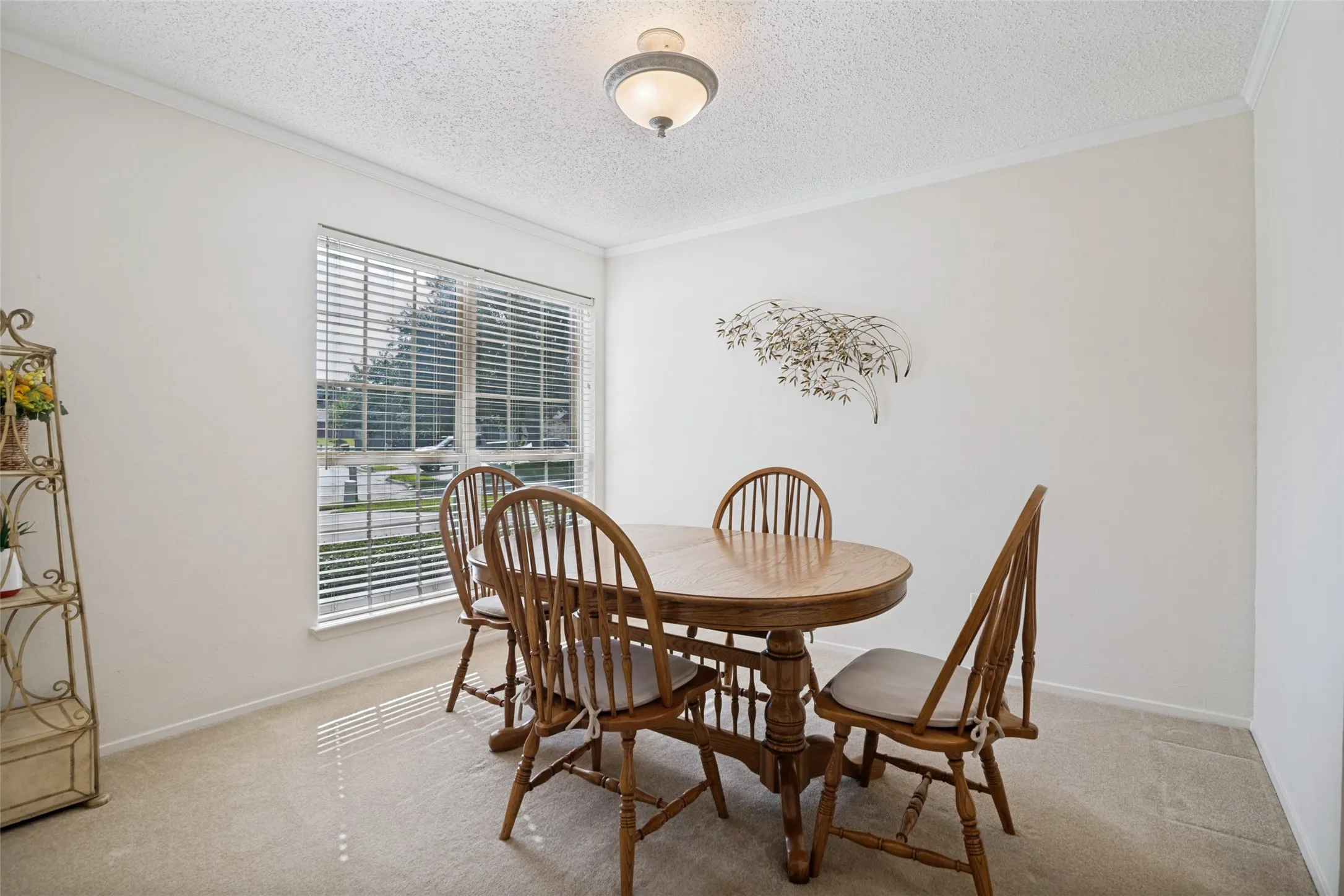 Dining space off the front of the home with a connection to kitchen