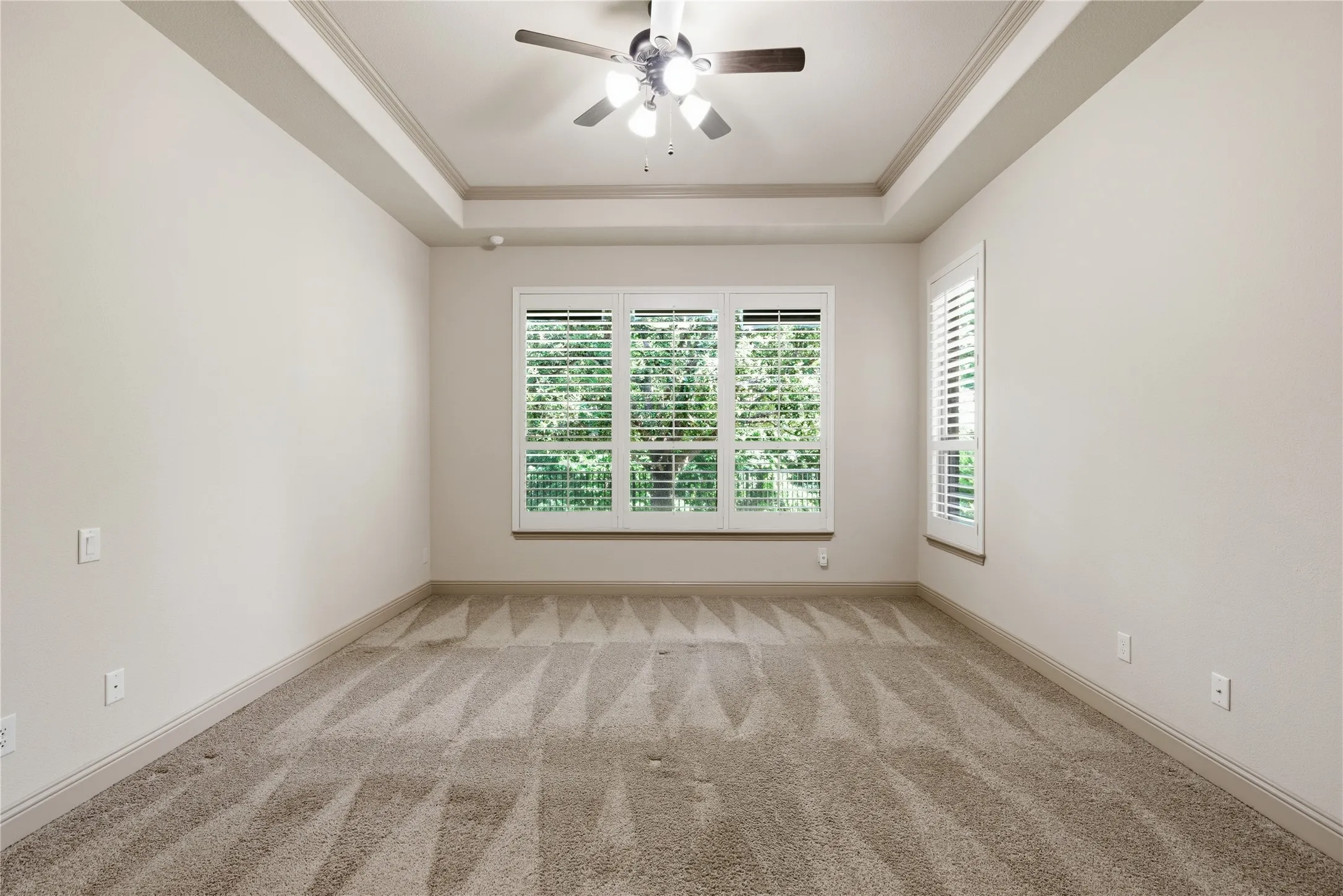Plantation Shutters and view of Wooded Area