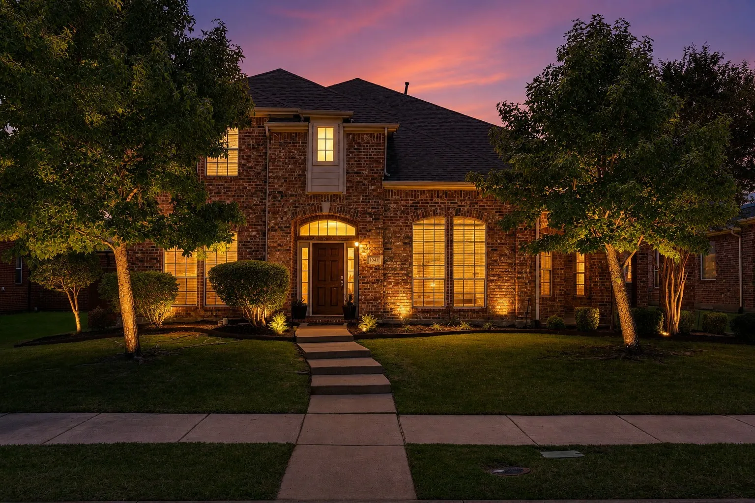 Brick facade with arched entryway and multiple arched windows