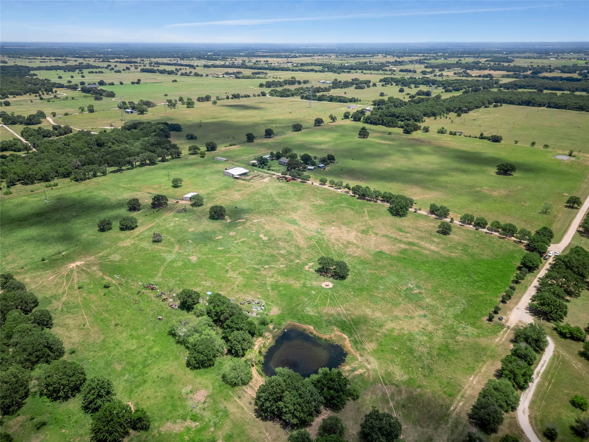 4 ponds and 3 water wells, mature oaks, private road