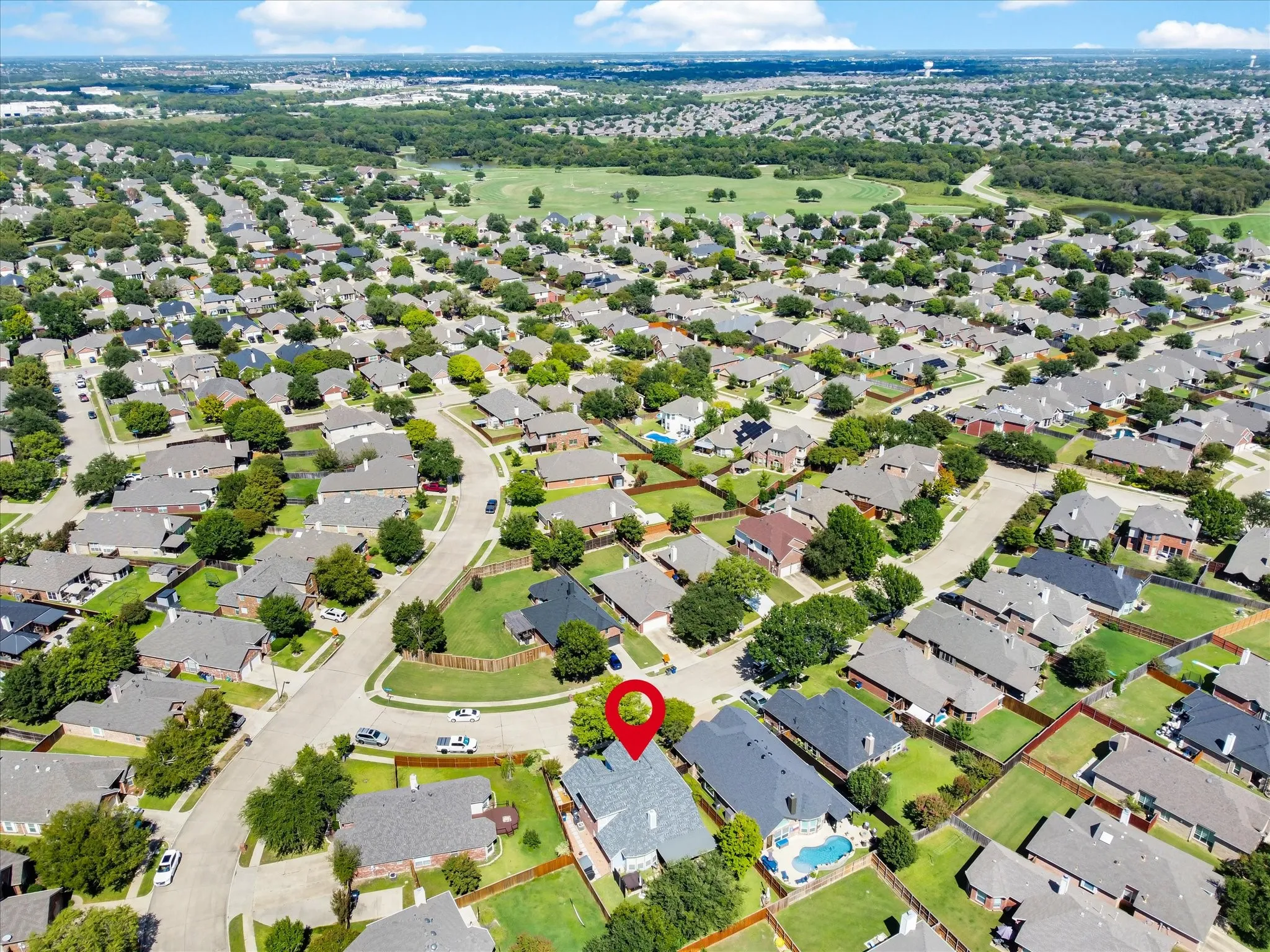 Aerial overview of a residential neighborhood with numerous single-family homes