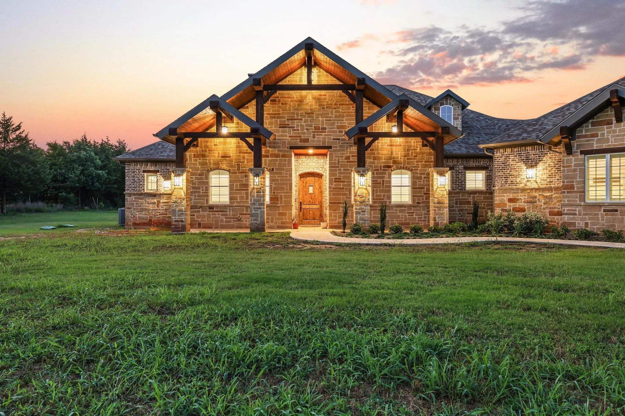 Stone exterior with wood-beam accents and a prominent gabled entrance