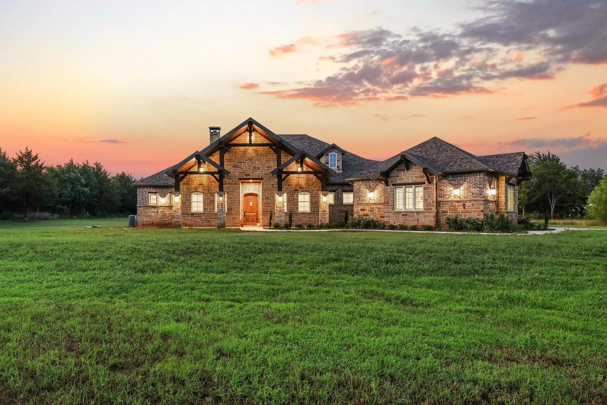 Stone-clad exterior with prominent gable rooflines and exposed timber architectural accents