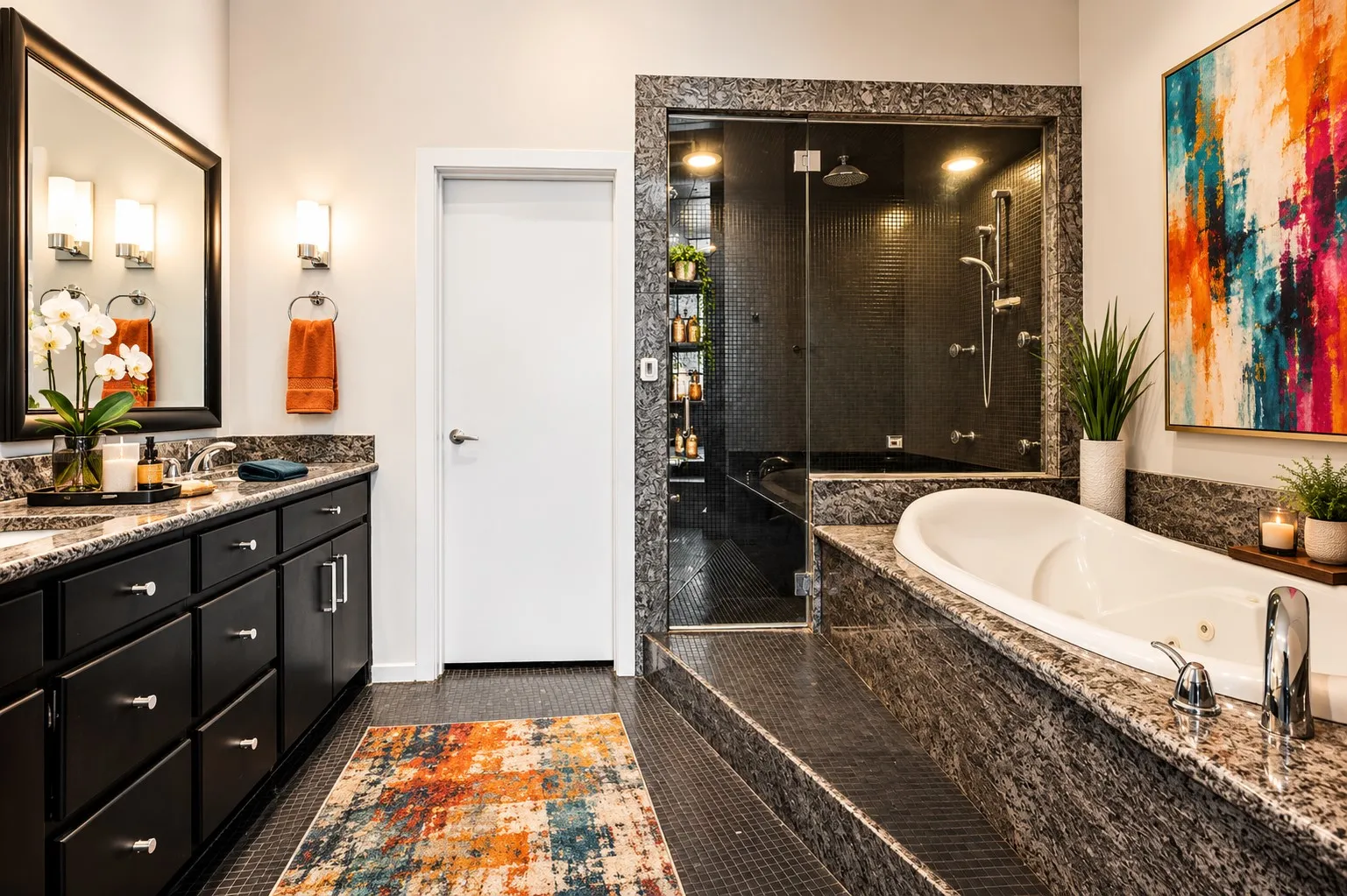 Double vanity with dark wood cabinetry and stone countertops
