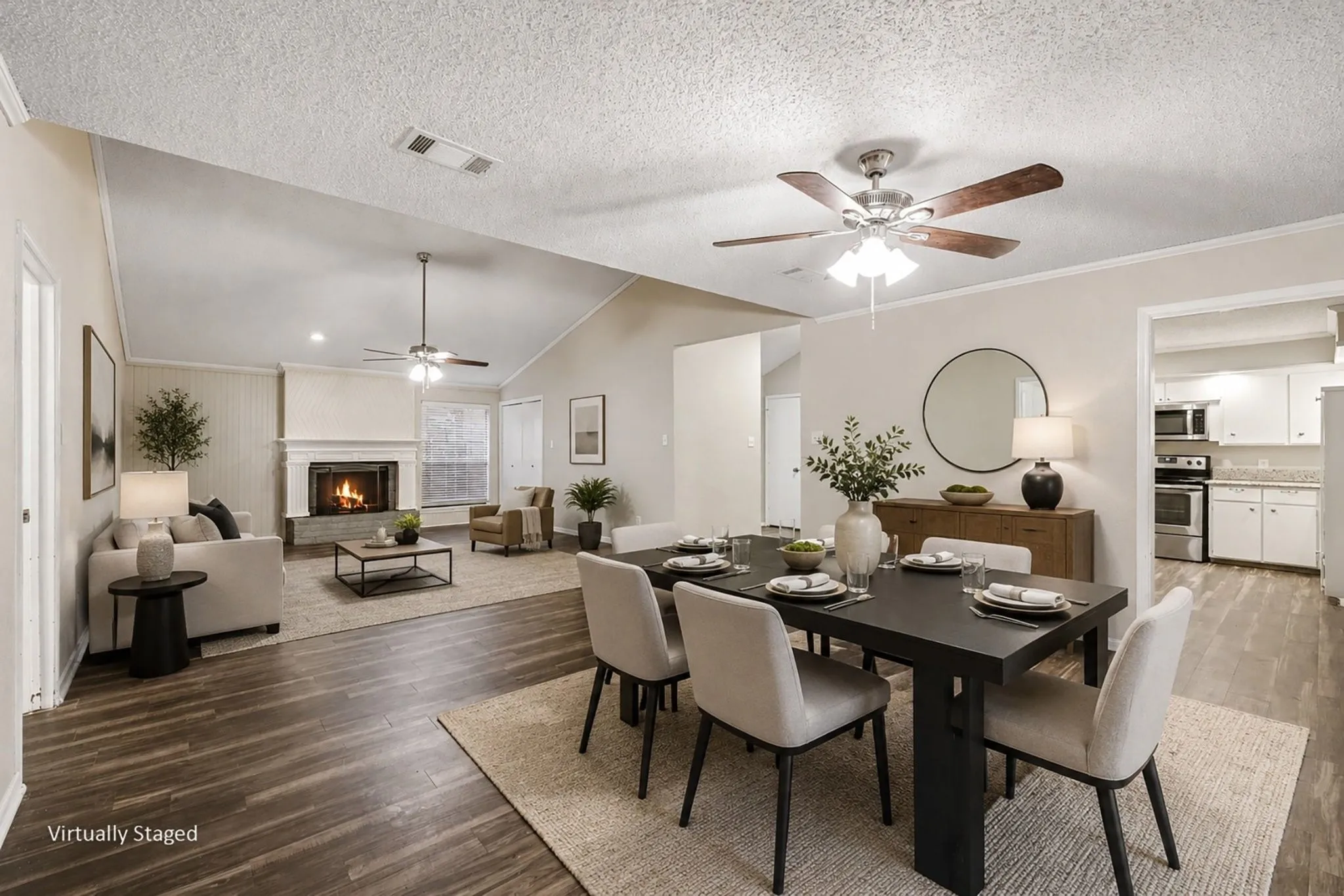 Virtually staged dining area and living room combo.