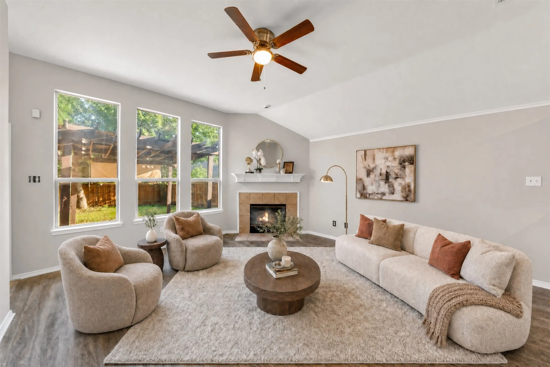 Step into a bright and spacious family room highlighted by vaulted ceilings, fresh paint, stylish new flooring, updated lighting, and a cozy fireplace that creates a warm, inviting atmosphere. Seamlessly connected to the kitchen, this open-concept living space offers the perfect blend of comfort, functionality, and modern appeal. Virtual staged