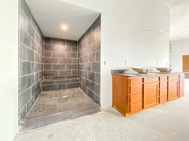 Ensuite Bathroom, cabinets are installed, sinks and fixtures are onsite but not installed in case buyer wants their own style sinks and fixtures,  15x19, triple shower head, jetted tub not attached in case they want a different tub