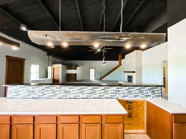 granite counter tops with granite island, Brand new GE dishwasher will stay, fridge is negotiable, oven is not ordered in case buyers want their own. Last cabinet is not installed in case buyer wants oversized oven