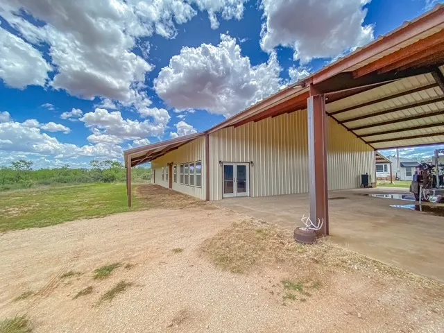 Car port with at least 6 cars to fit under, breezeway between Barndo and Workshop