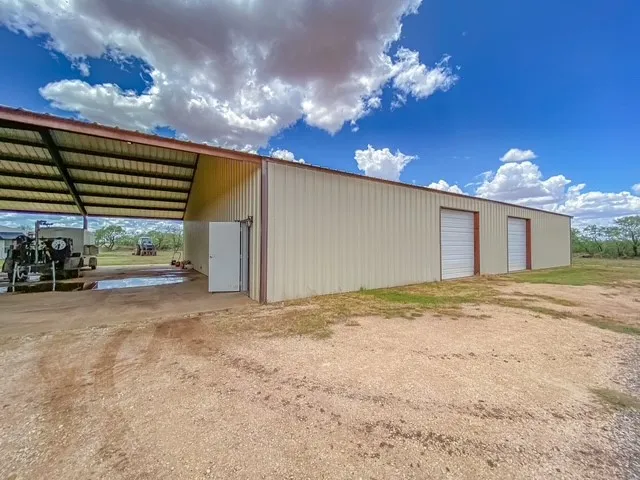 Front of workshop to include 2 12 ft garage doors