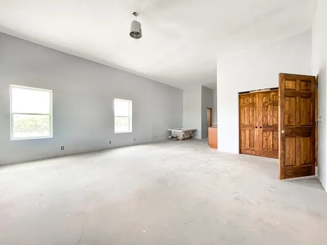 19x19 with ensuite bath, also has a walk in closet 9x7ft and private entrance to the front, in front of private entrance is a 10 ft overhang