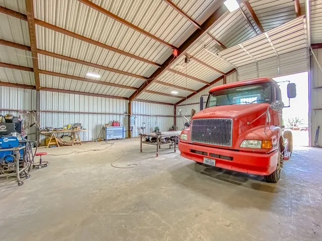 9 electrical 110 and 220 drops, Semi truck and all personal property is not included. 14 ft garage door is displayed in photo