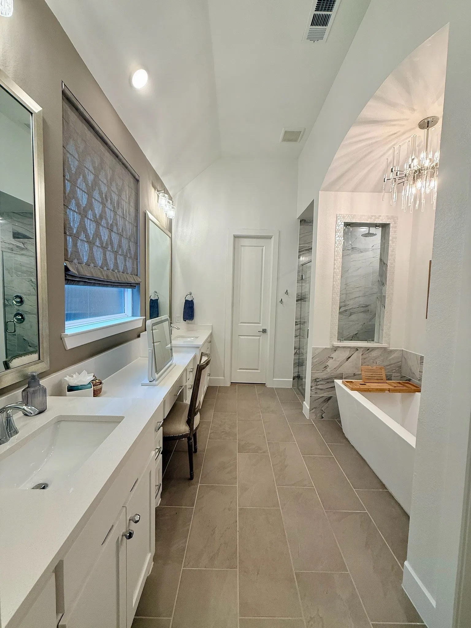 Primary bathroom with freestanding tub and shower with dual shower heads