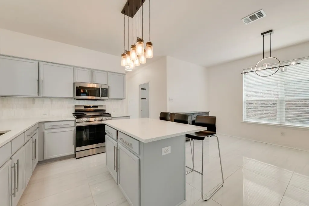 Gorgeous kitchen area with island and updated cabinets.