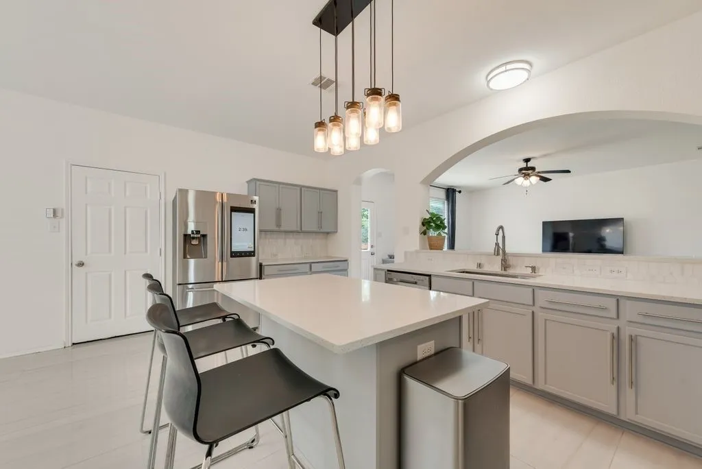 Separate view of the enormous kitchen.