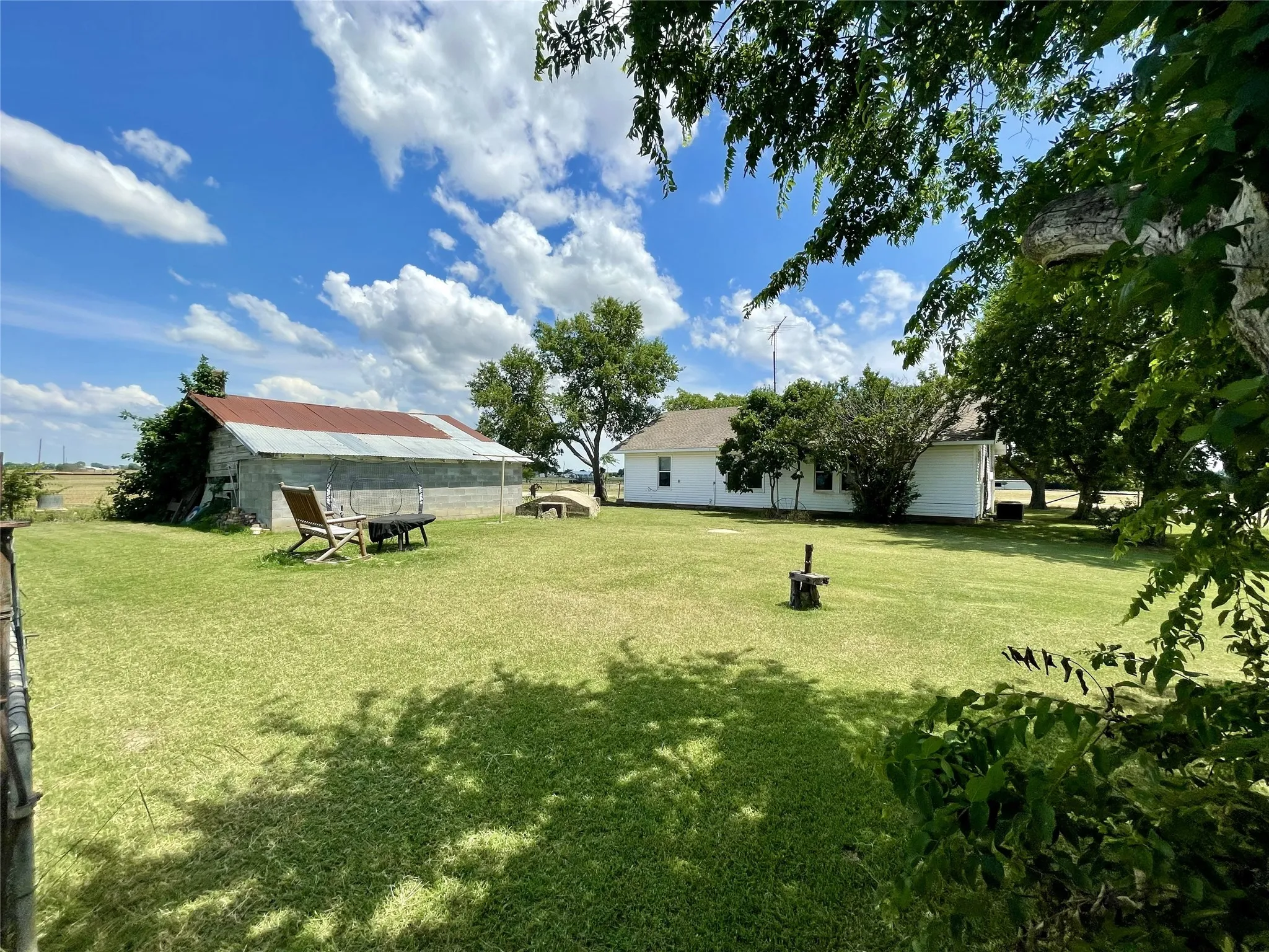 The spacious backyard is perfect for relaxing and enjoying the outdoors.