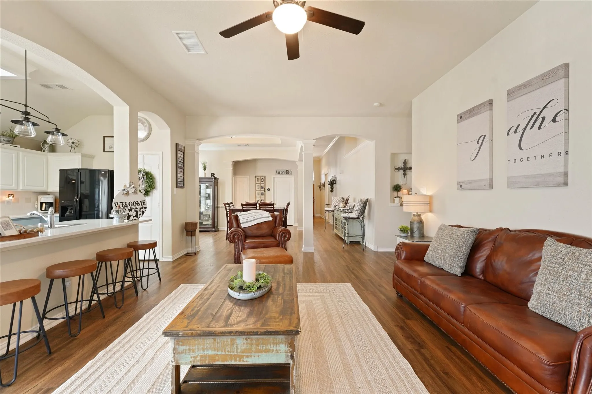 Open-concept design allows for effortless movement throughout the main living areas. High ceilings and natural light make the space feel even larger while maintaining a warm and inviting atmosphere.