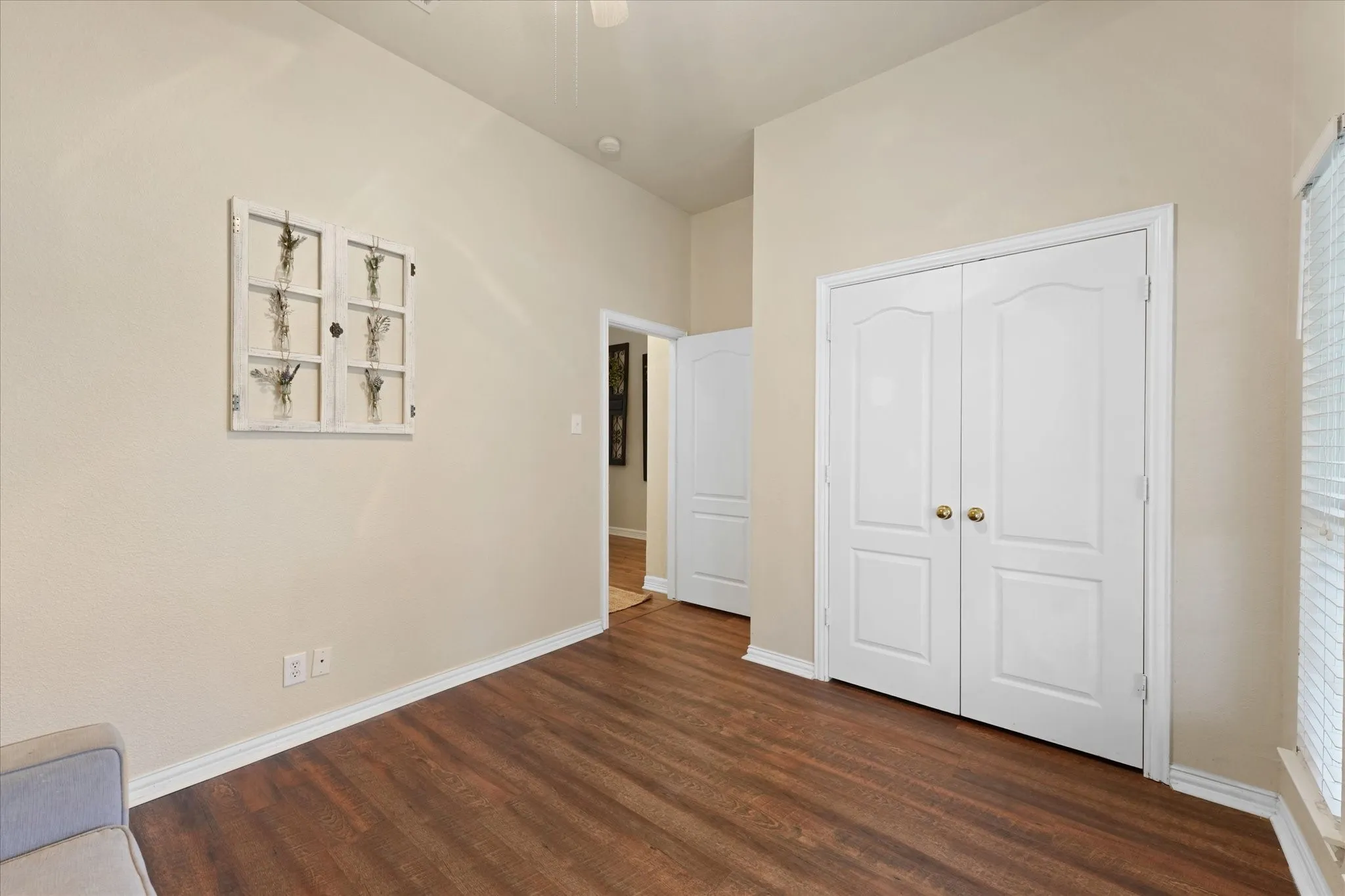 The flexible floor plan allows this room to adapt to your lifestyle. High ceilings, updated flooring, and generous wall space provide endless possibilities for work, dining, or relaxation.