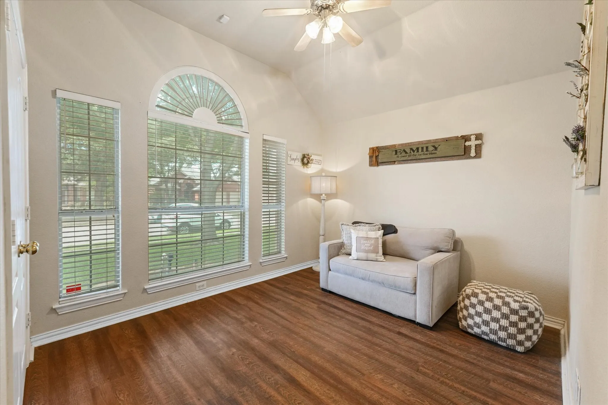 Located just off the entry, this versatile space can serve as a formal dining room, home office, second living area, playroom, or study. Large arched windows fill the room with natural light.
