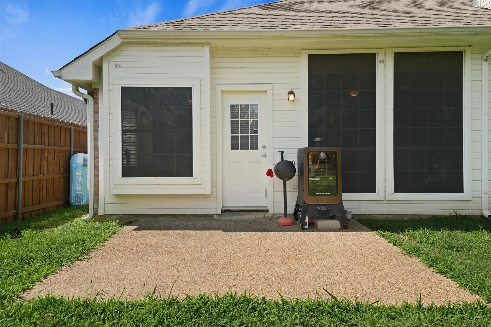 back patio provides a comfortable outdoor space for grilling, relaxing, or entertaining guests. Easy access from the home makes indoor-outdoor living convenient year-round.