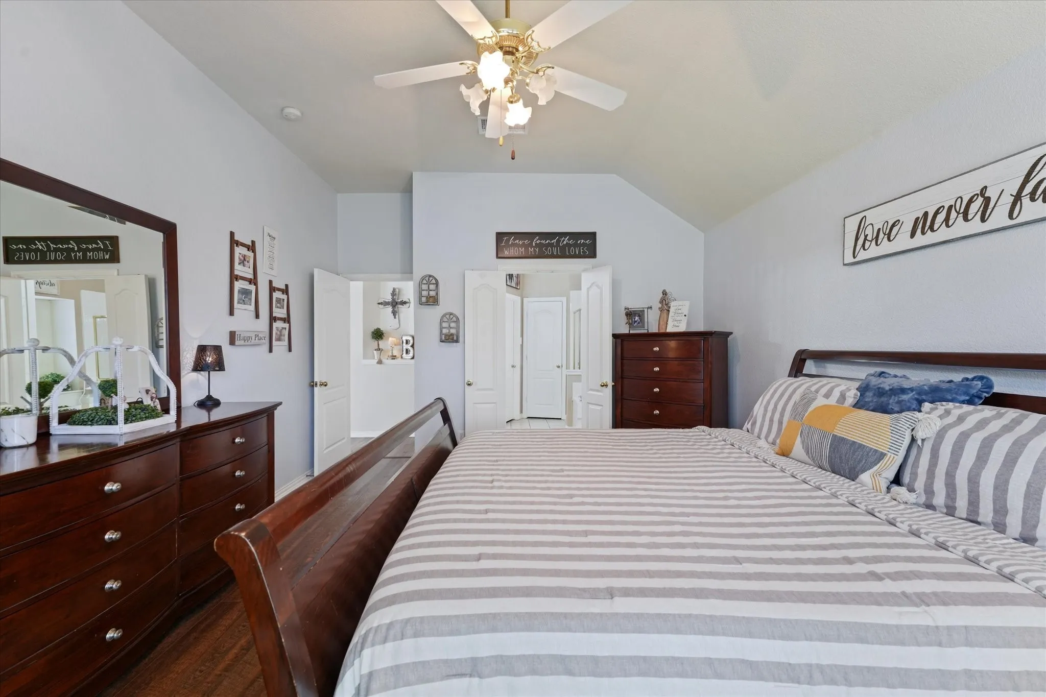 Private owner's retreat with ample wall space, elevated ceilings, and direct access to the en-suite bathroom. A comfortable space designed for both relaxation and functionality.