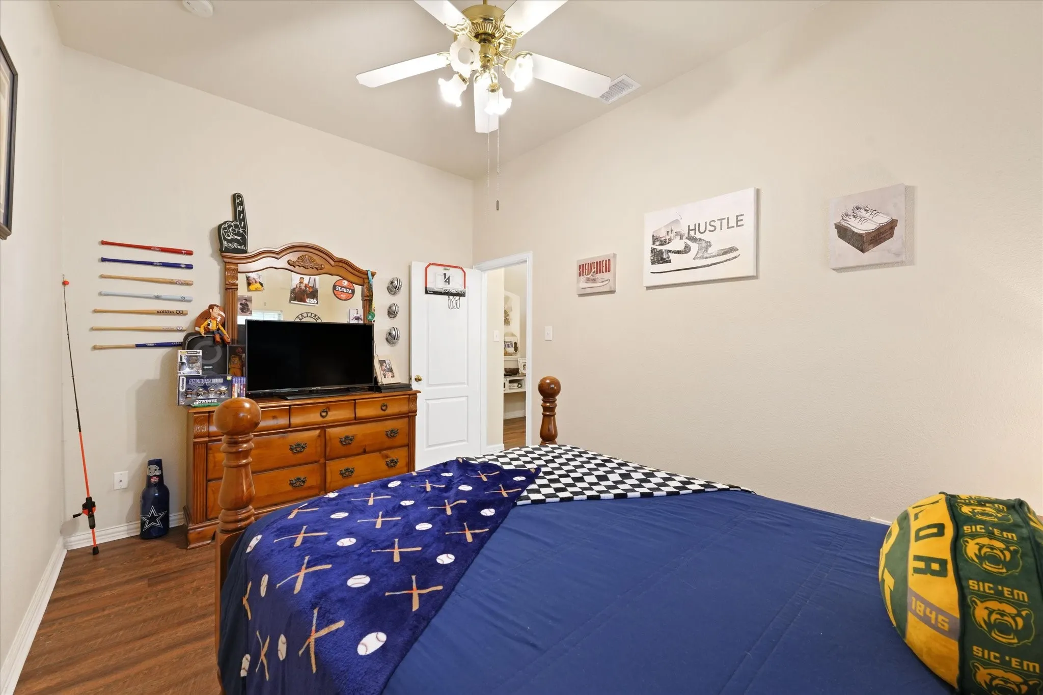 Another view of this generously sized secondary bedroom showcasing vaulted ceilings, abundant natural light, and excellent storage with a walk-in closet.