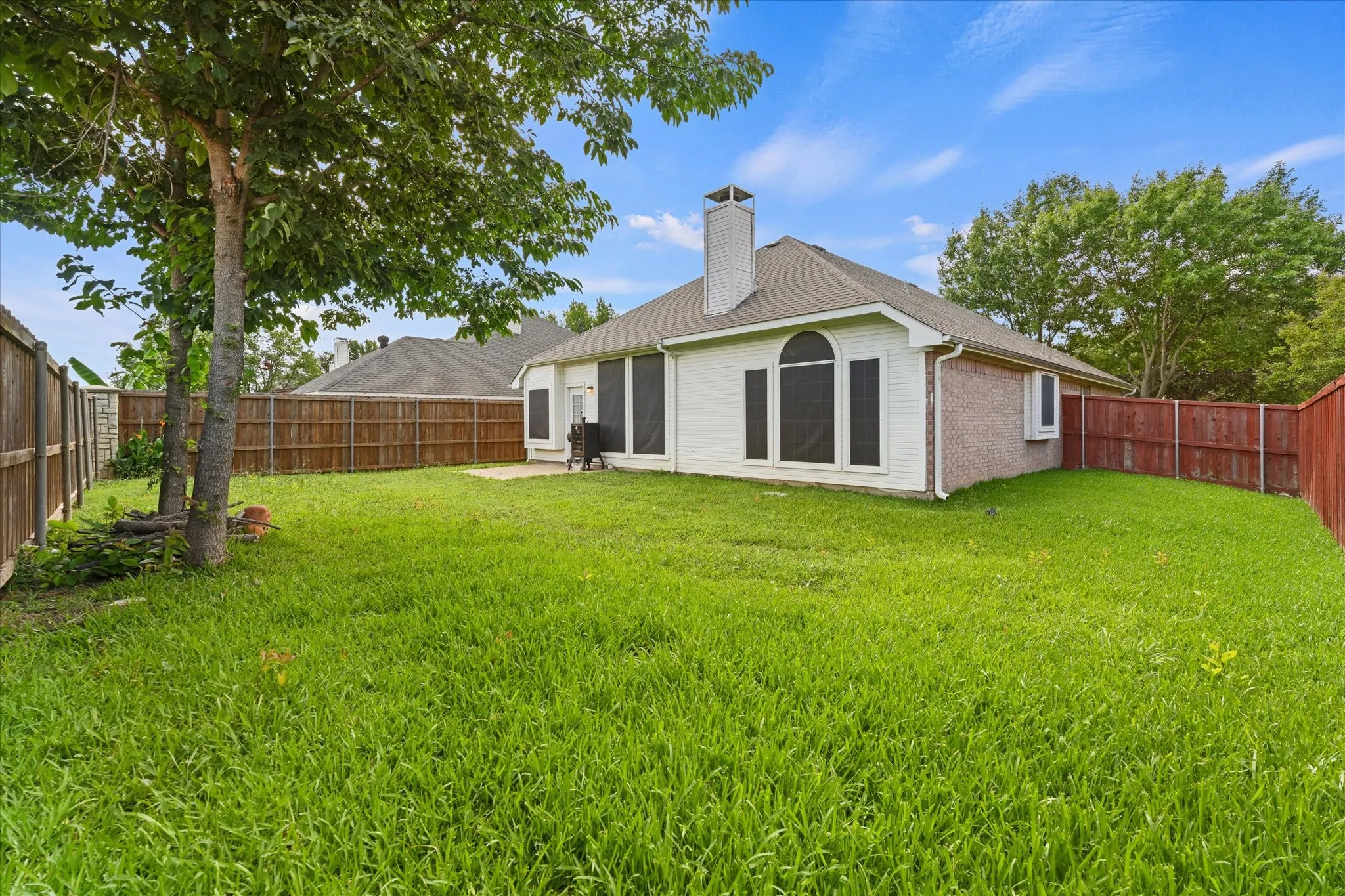 Enjoy a spacious backyard with room to spread out, entertain, or simply unwind. The combination of usable yard space, mature landscaping, and outdoor living area creates a backyard that is both functional and inviting.