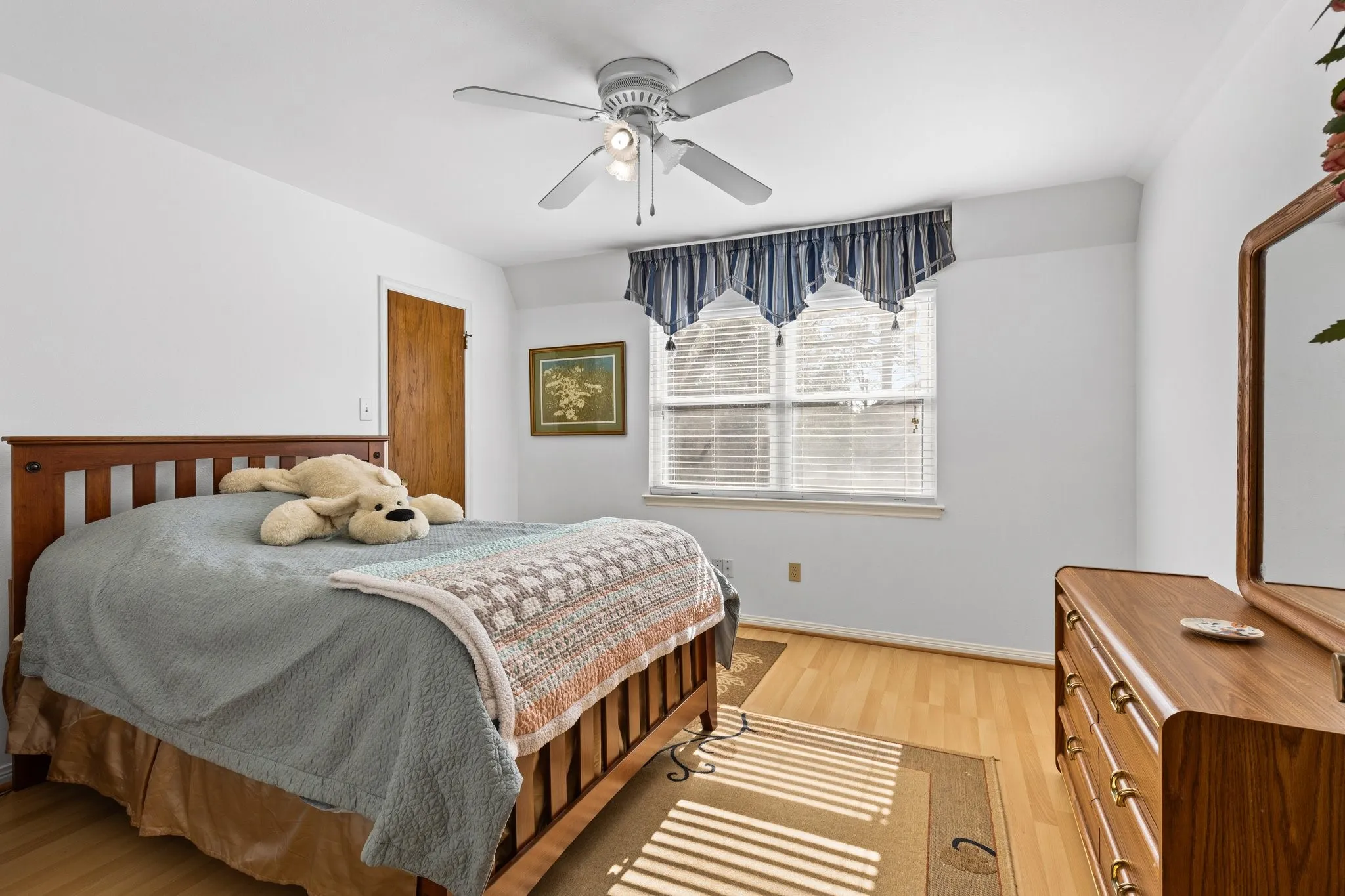 Secondary bdrm #3 is more private (at end of hallway), w/ vinyl flooring and walk-in closet.