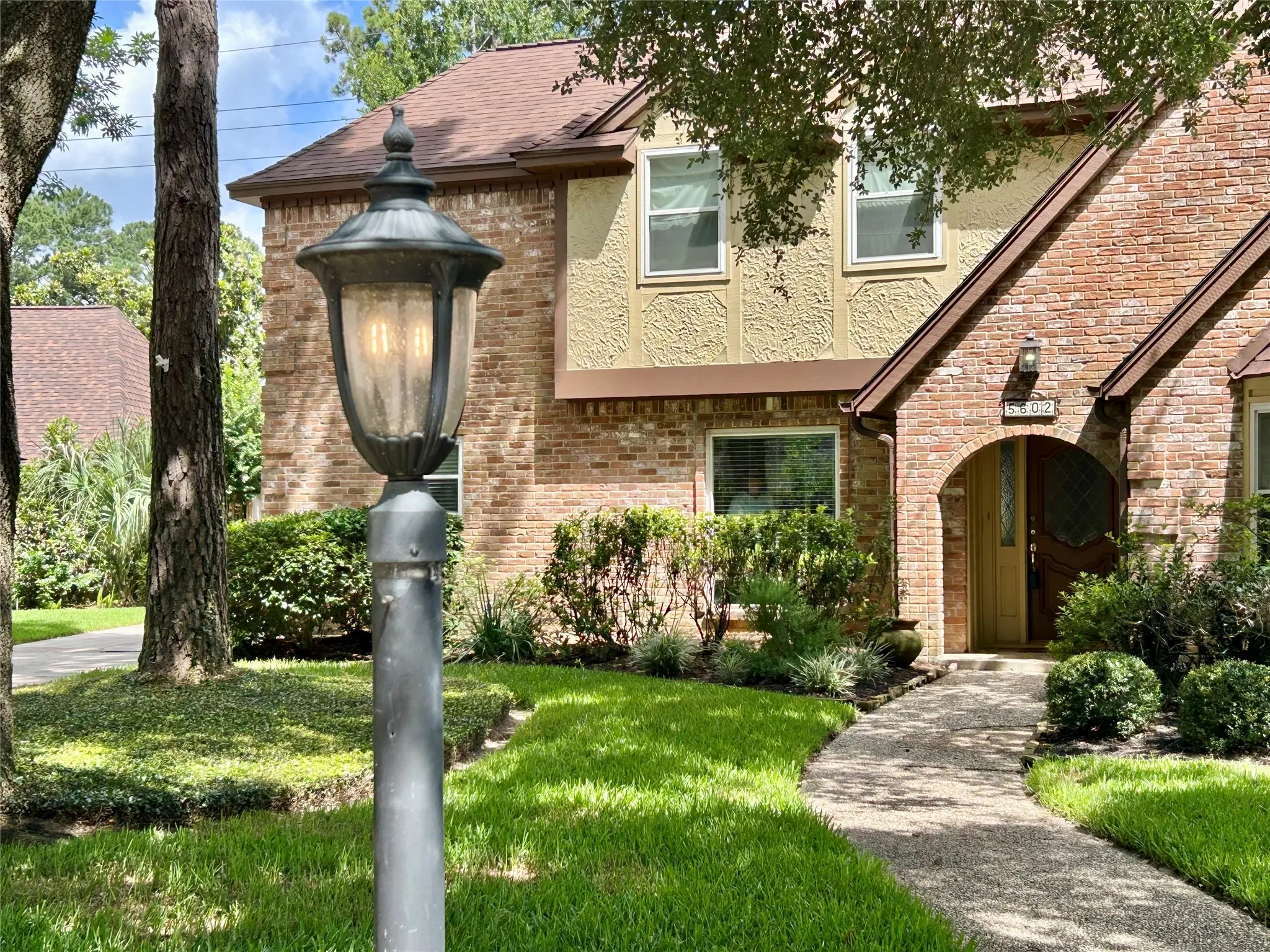 Welcome! Lush landscaping, front and back, well-maintained, non-smoking, with double-paned windows and new-ish roof (2023)! Lamp has been converted to electric.