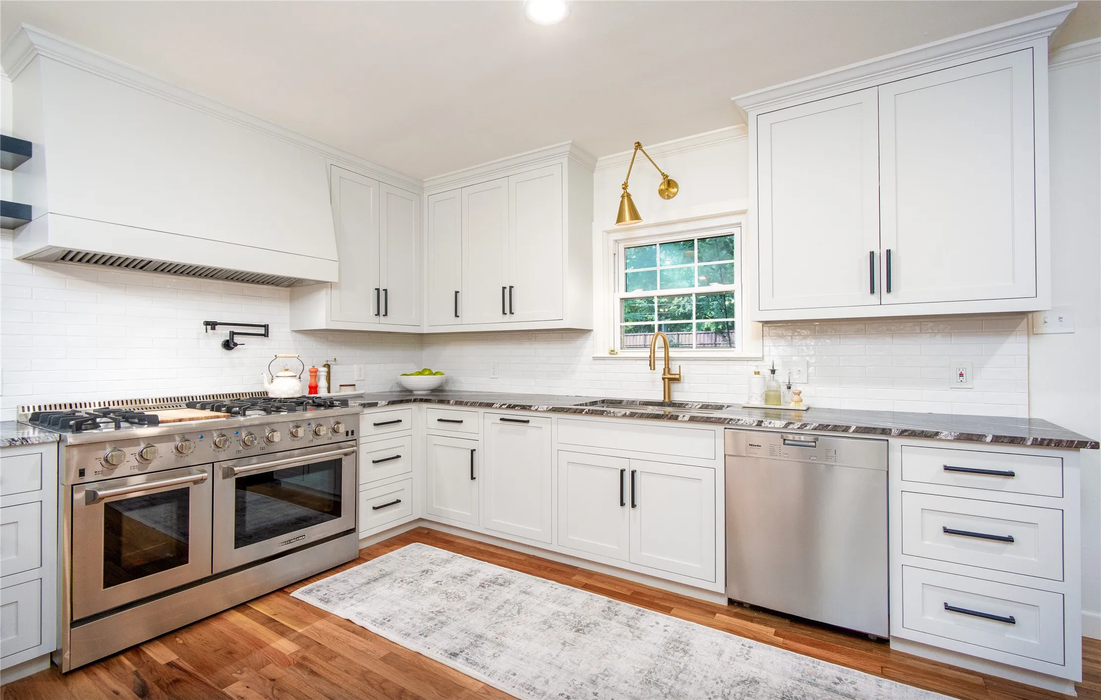 Renovated kitchen with view of the backyard