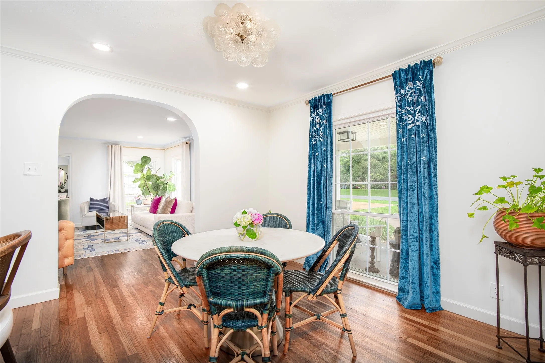 Adorable dining room with floor to ceiling windows
