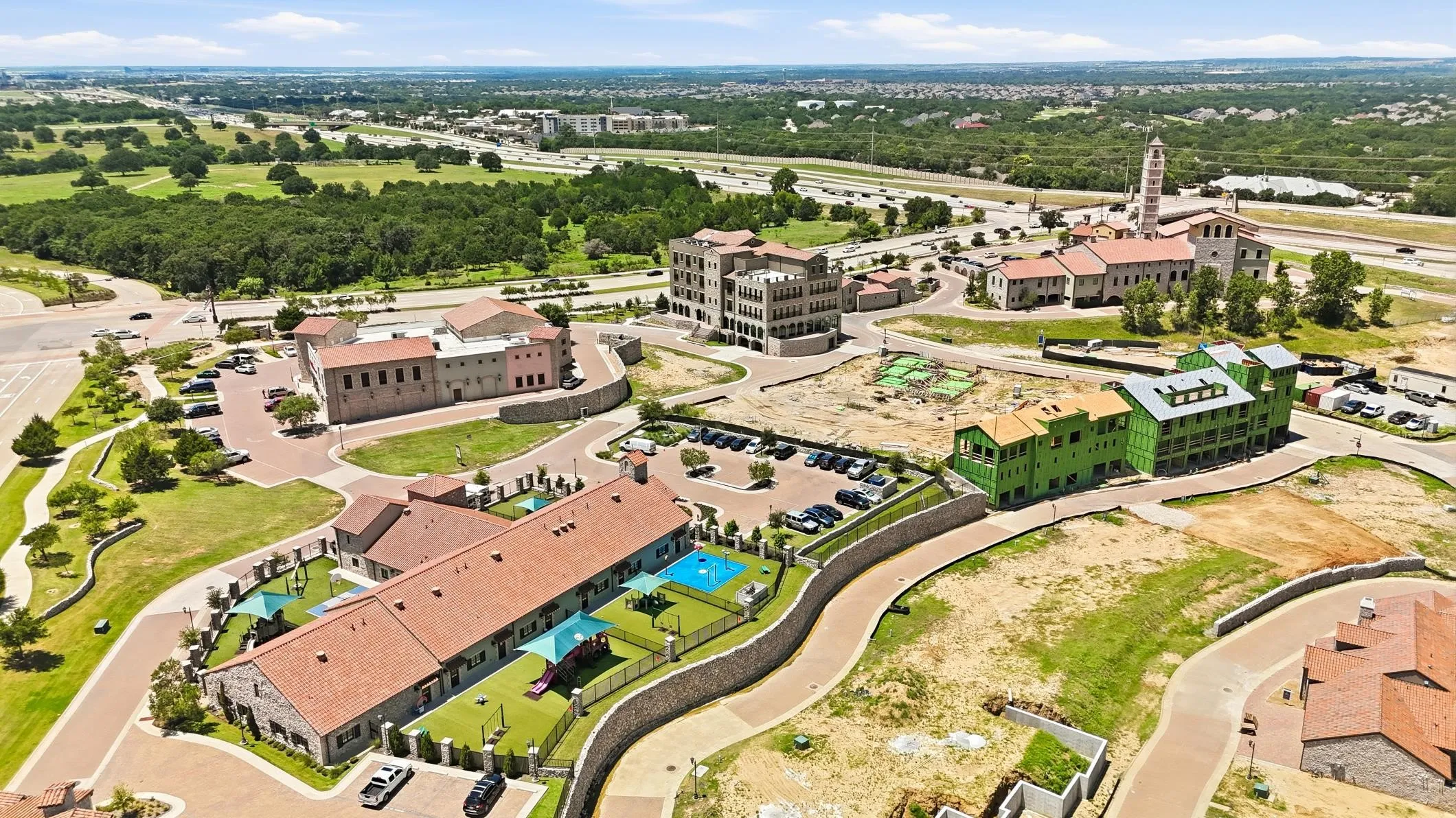 Aerial perspective showcasing a developing community with various architectural styles