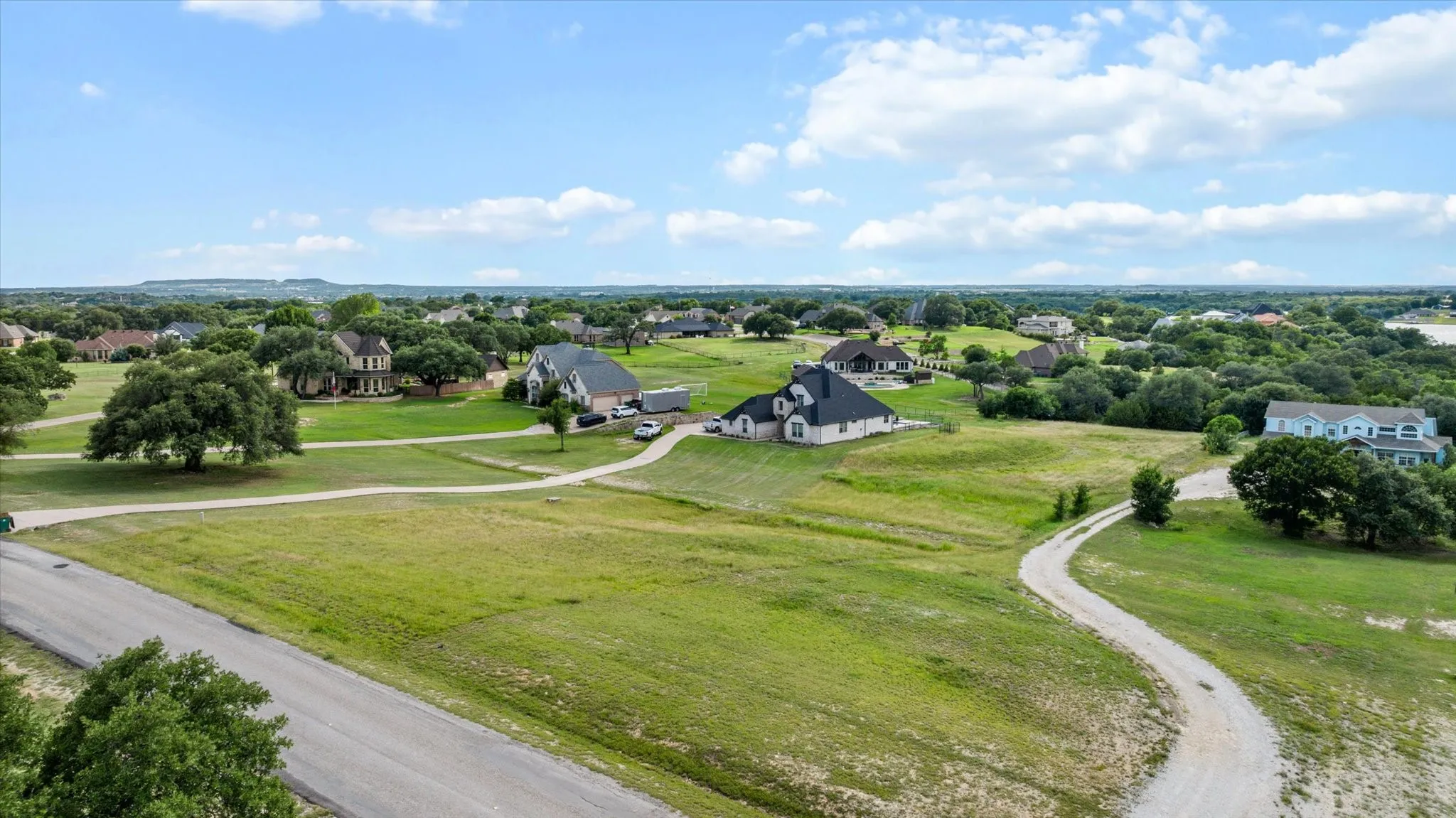 Expansive property featuring a paved road frontage