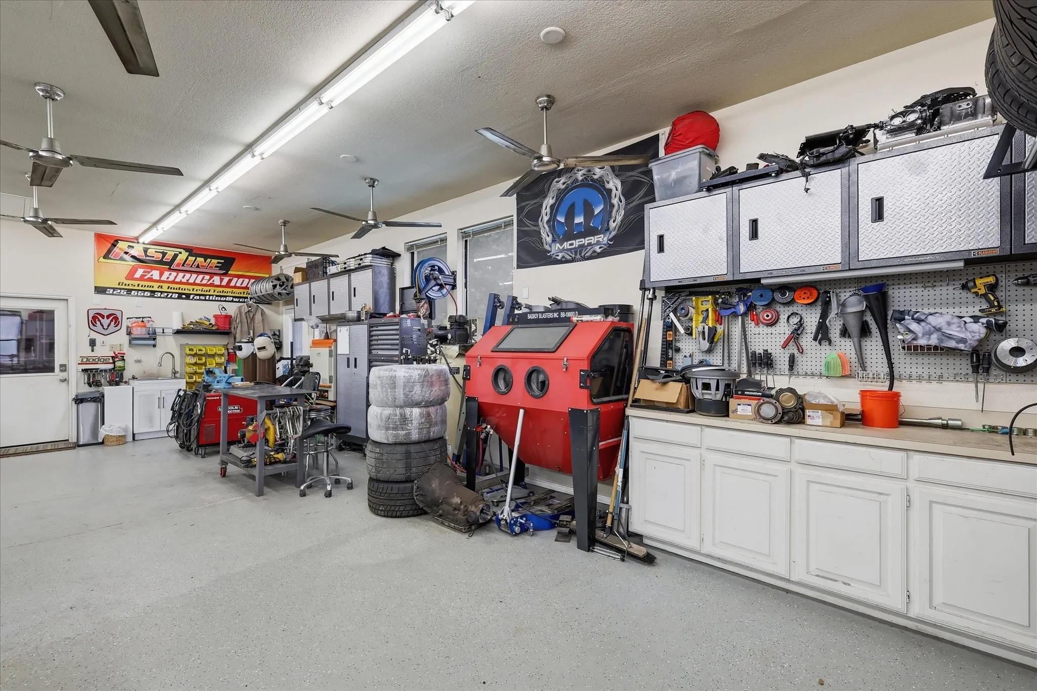 3 car, oversized garage used as a shop with HIGH Ceilings!