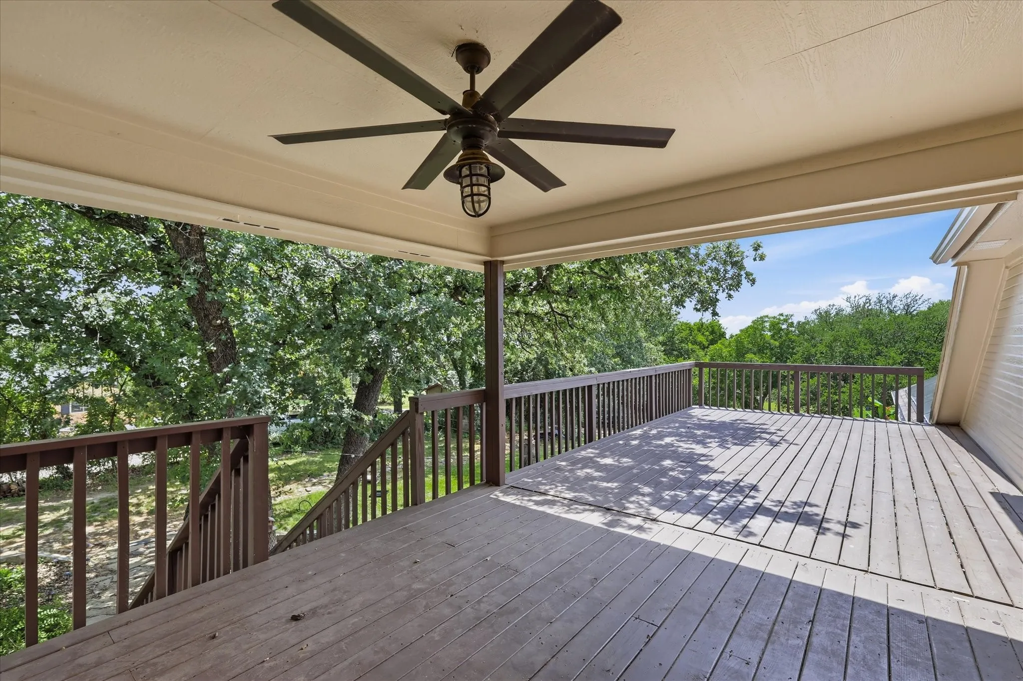 Half covered upstairs patio, over looking pool and yard