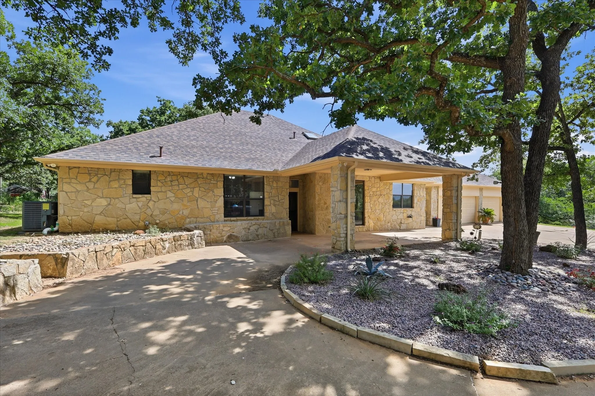 Circle drive with covered parking and ample parking areas
