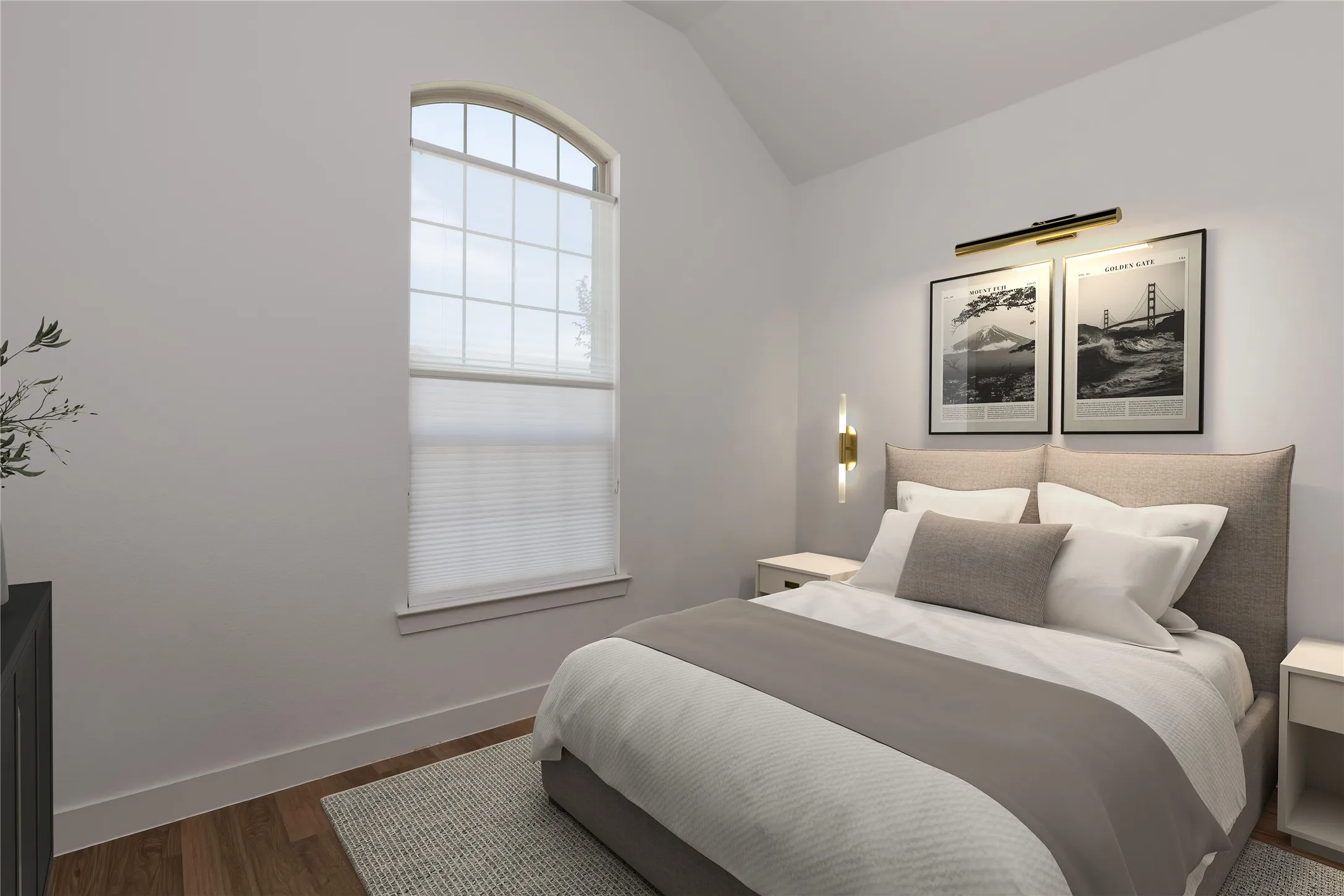 Room featuring a vaulted ceiling and an arched window