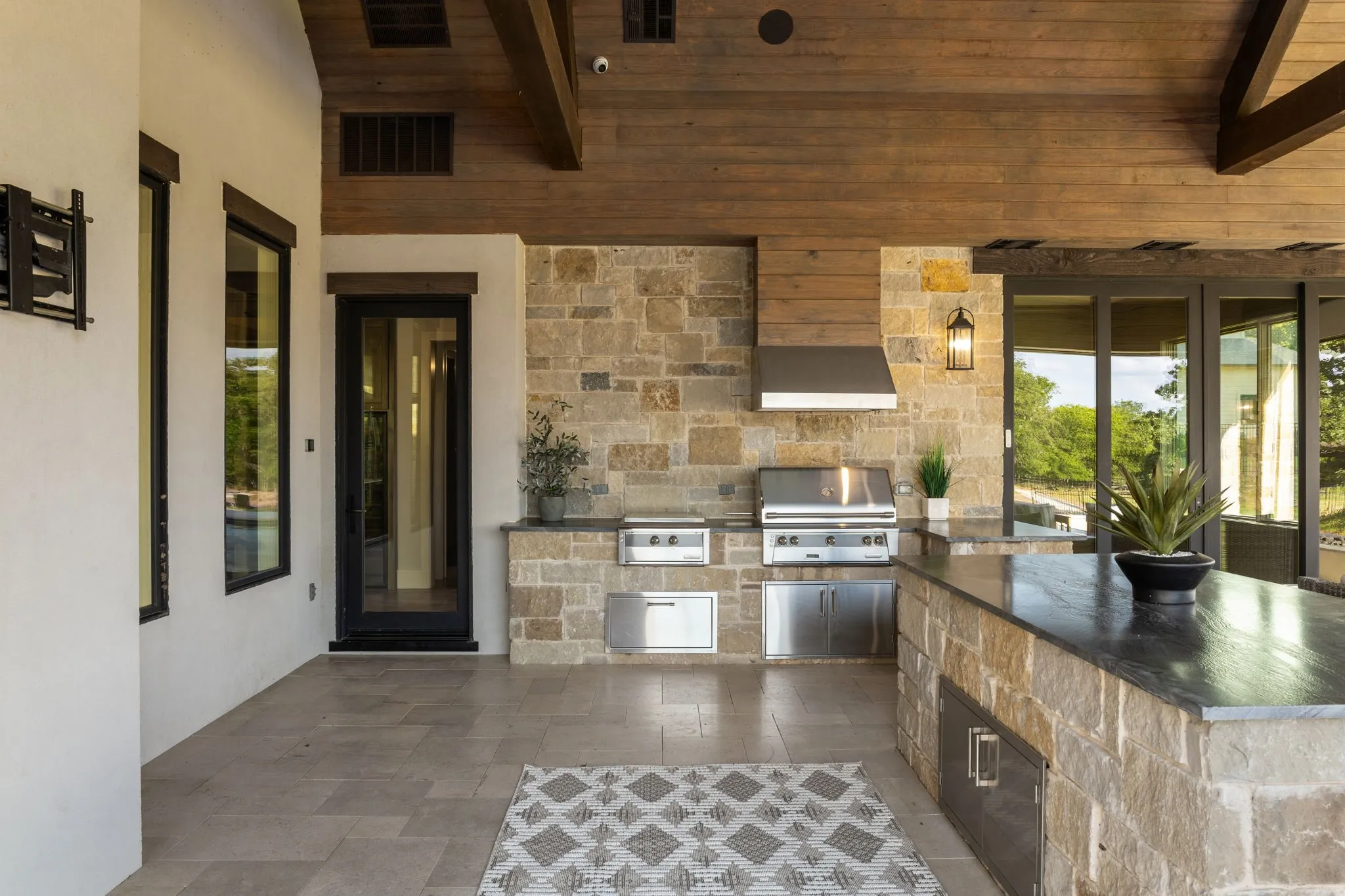 910 sq ft outdoor living space with grilling center and large island