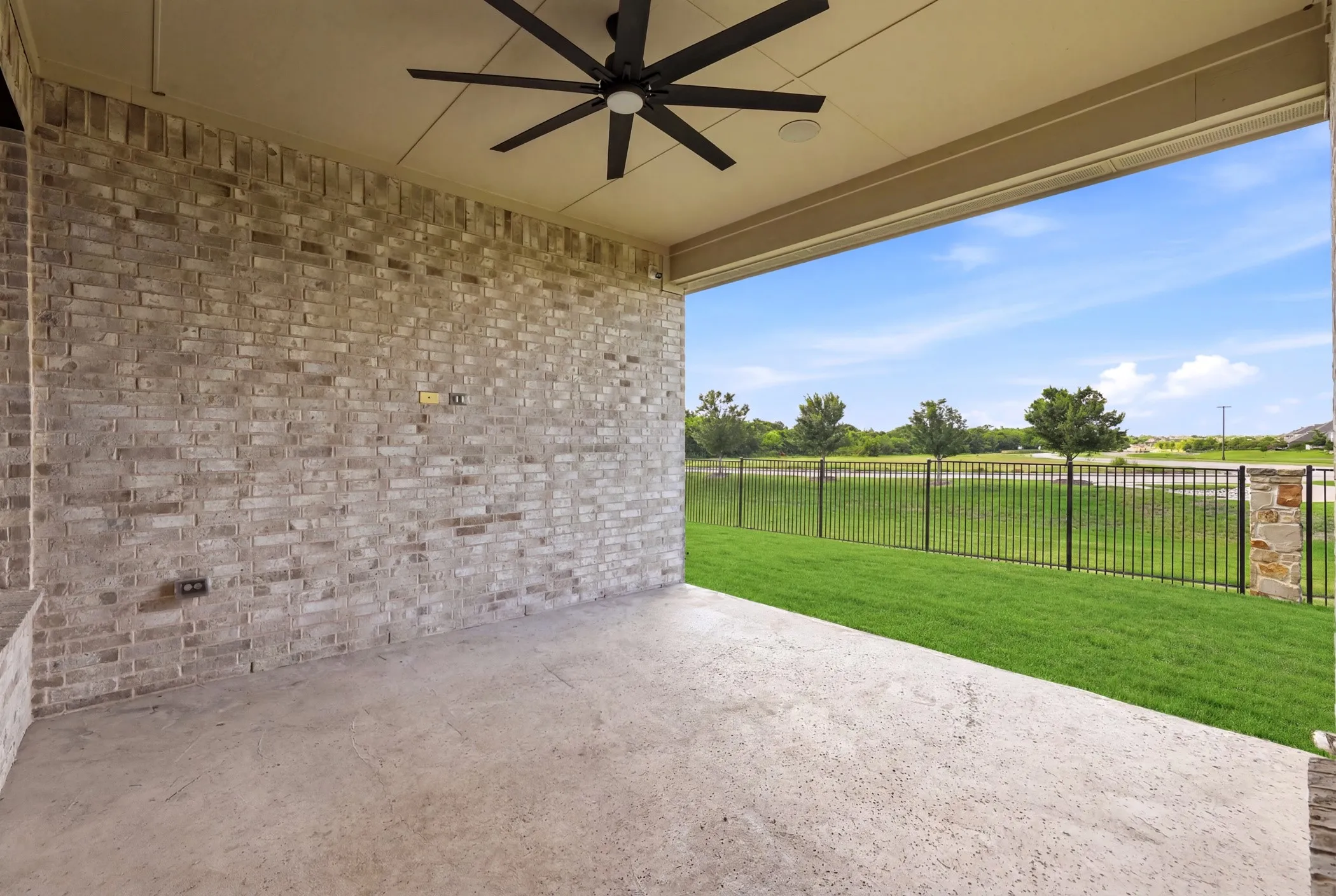 Large covered patio with green views and no houses behind!