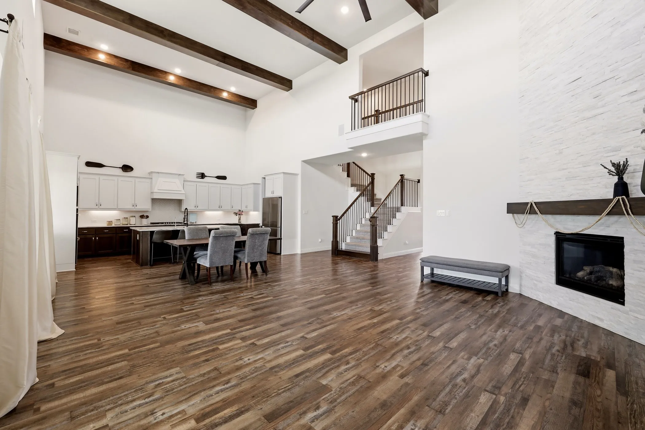 Gorgeous exposed wood beams in living room showing off the soaring 20 foot ceilings!