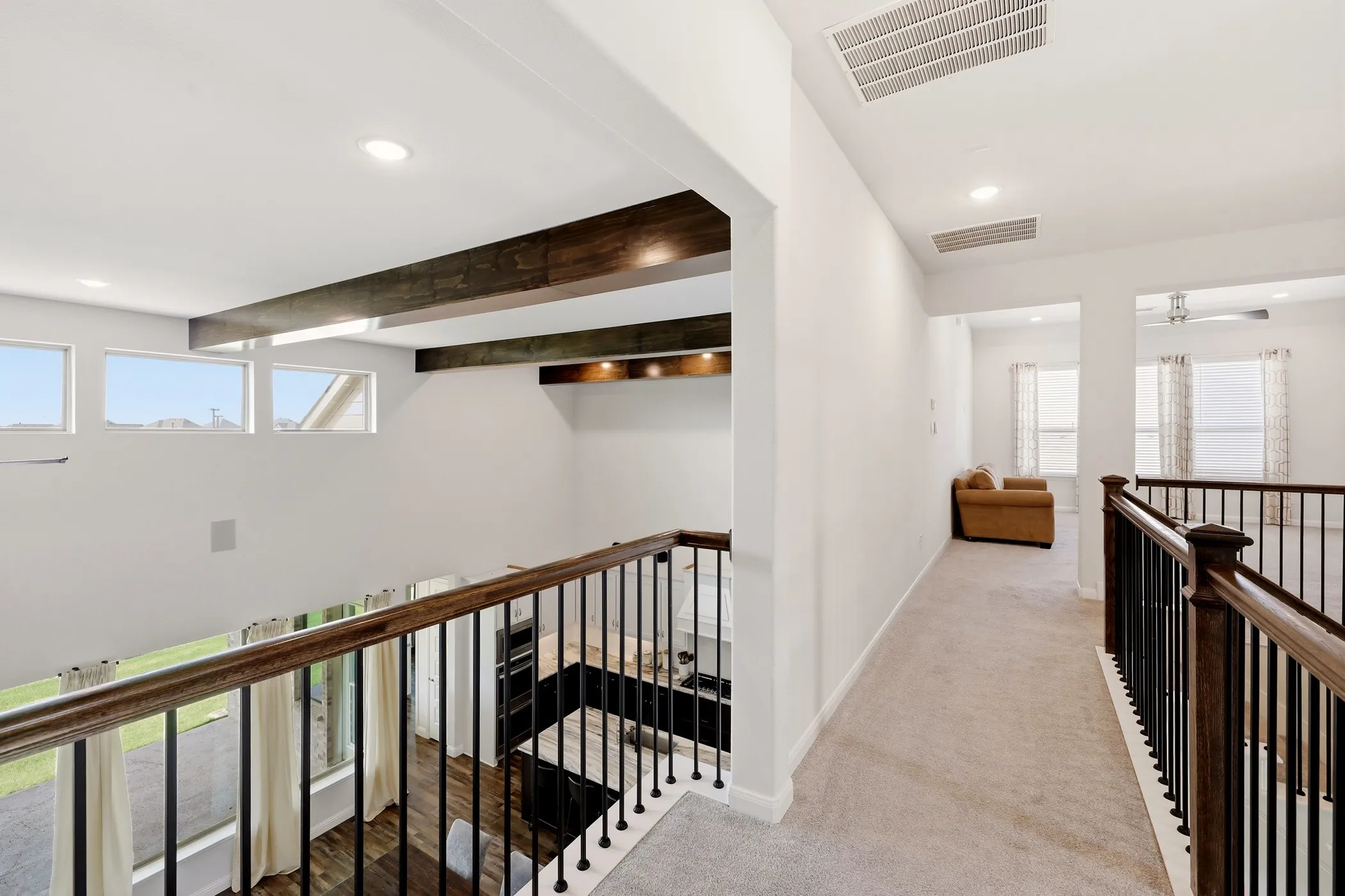 Great view of wood beams from the upstairs cat walk to gameroom!