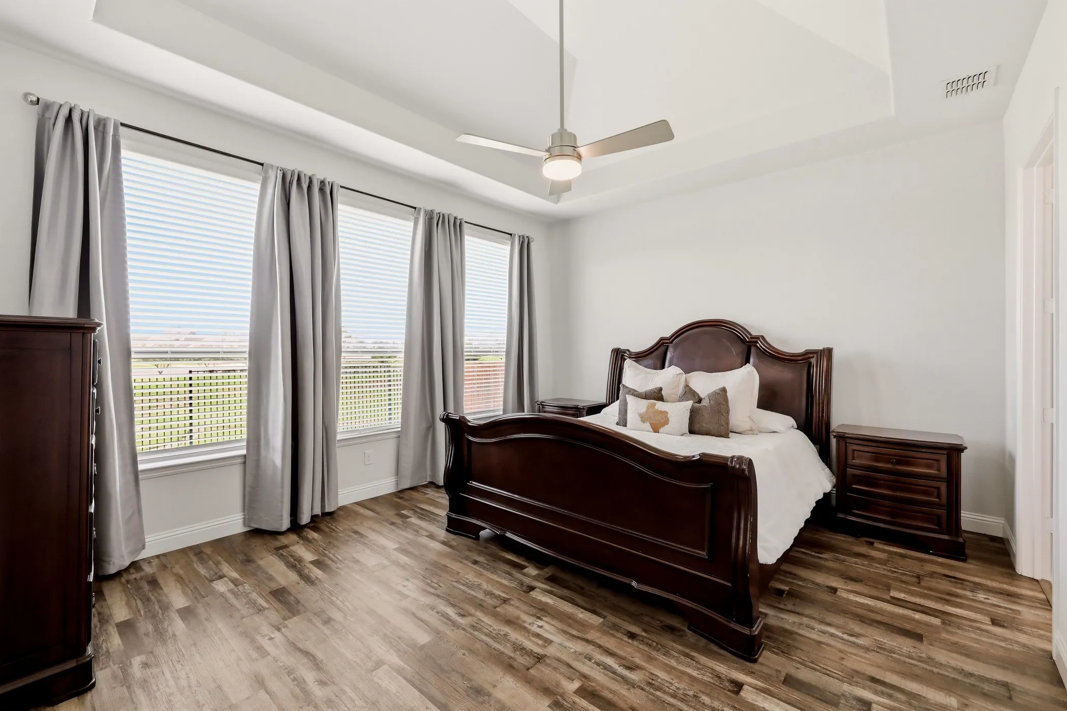 Huge primary suite with backyard views.