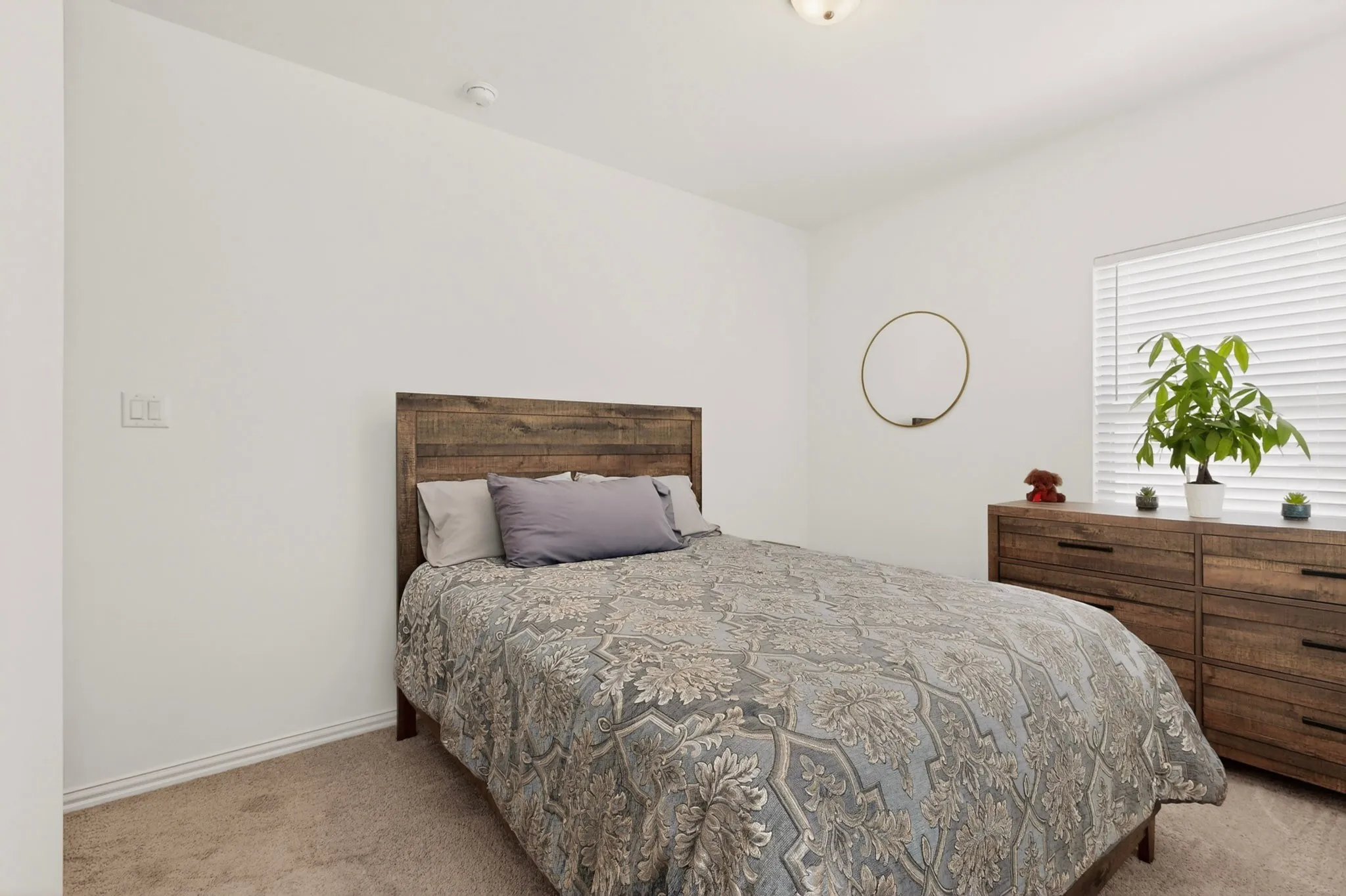 A simple, bright bedroom with a window