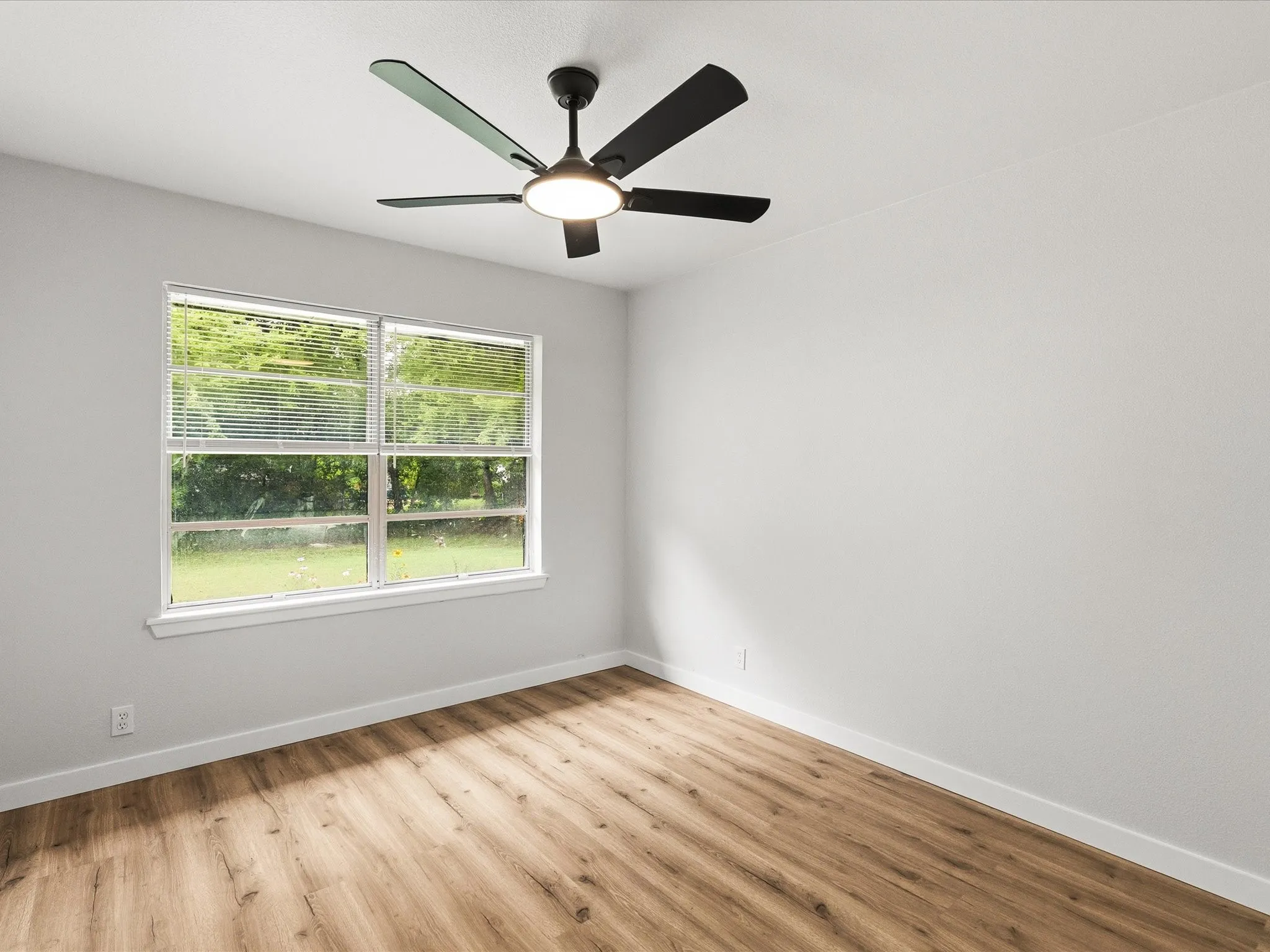 Second and third bedrooms features new paint, new floors, and ceiling fans.