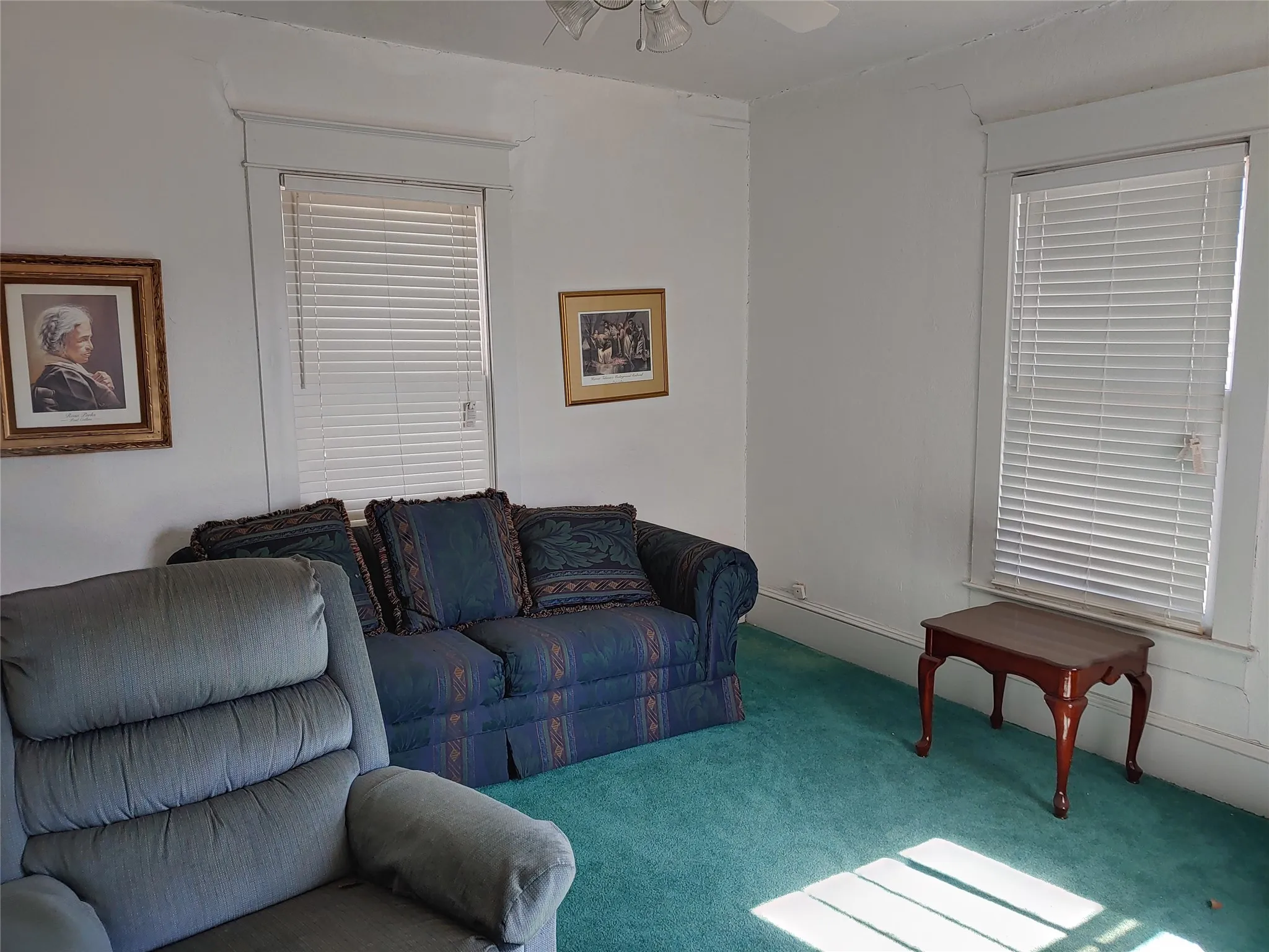 Room featuring light-colored walls and a wall-to-wall carpet