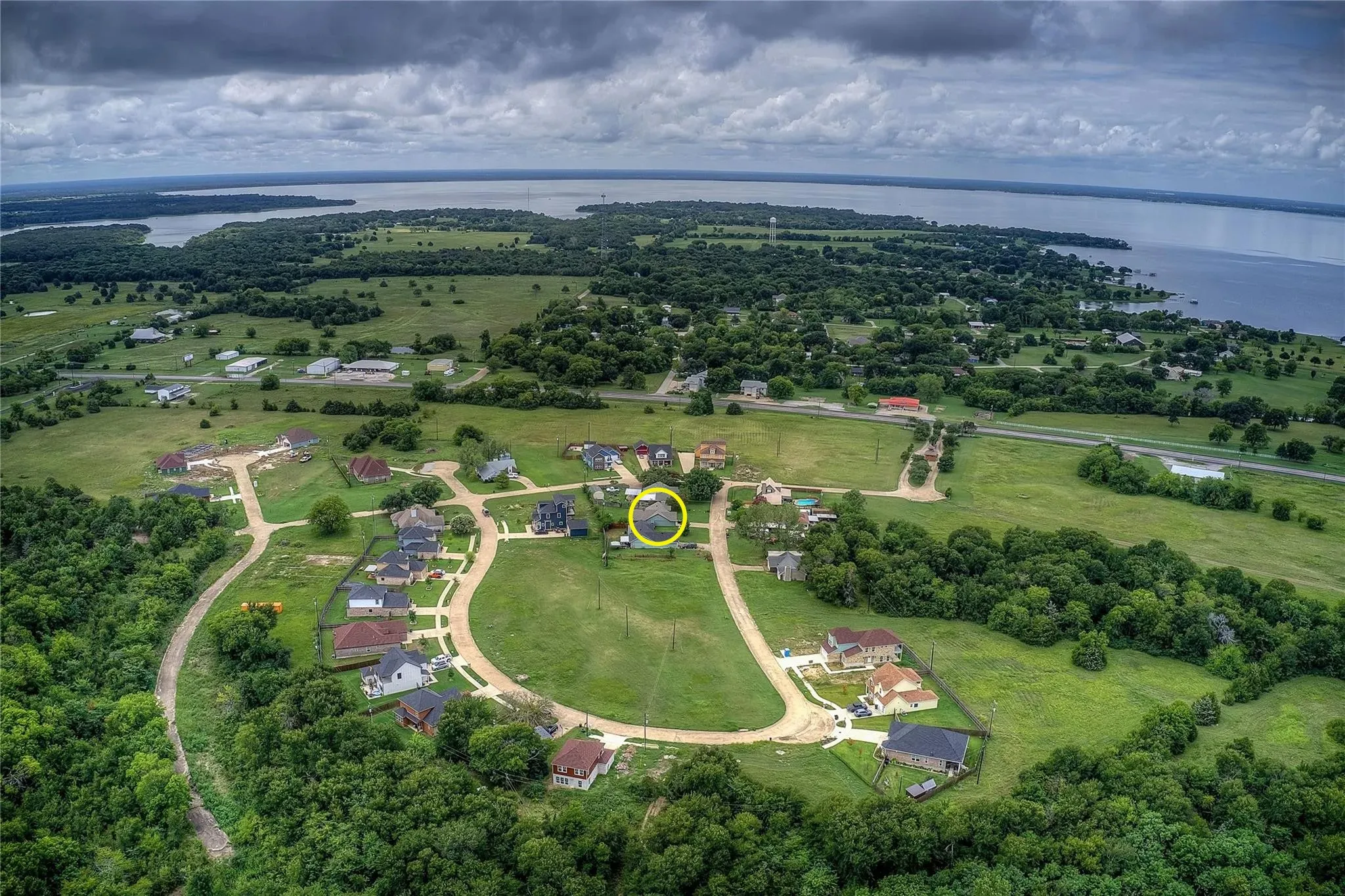 Aerial perspective of a near-by lake and neighborhoods